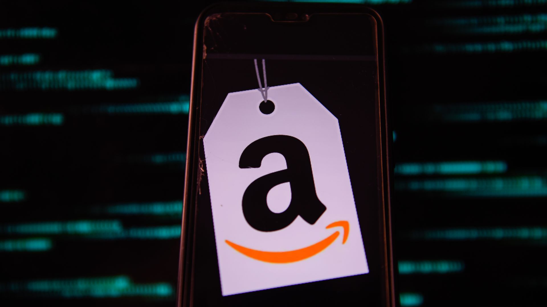 A photo illustration of a smartphone displaying the Amazon logo.