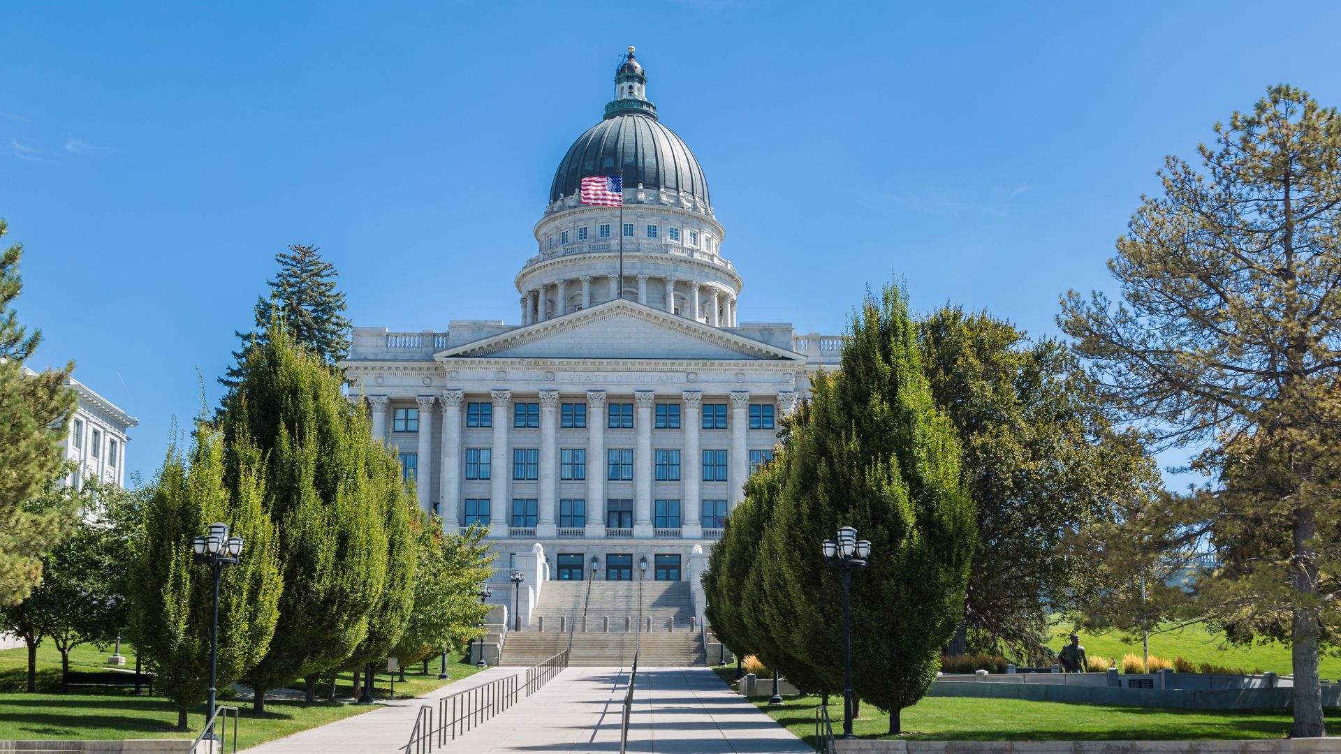 American flag flying over the Utah State Capitol building in Salt Lake City, Utah.