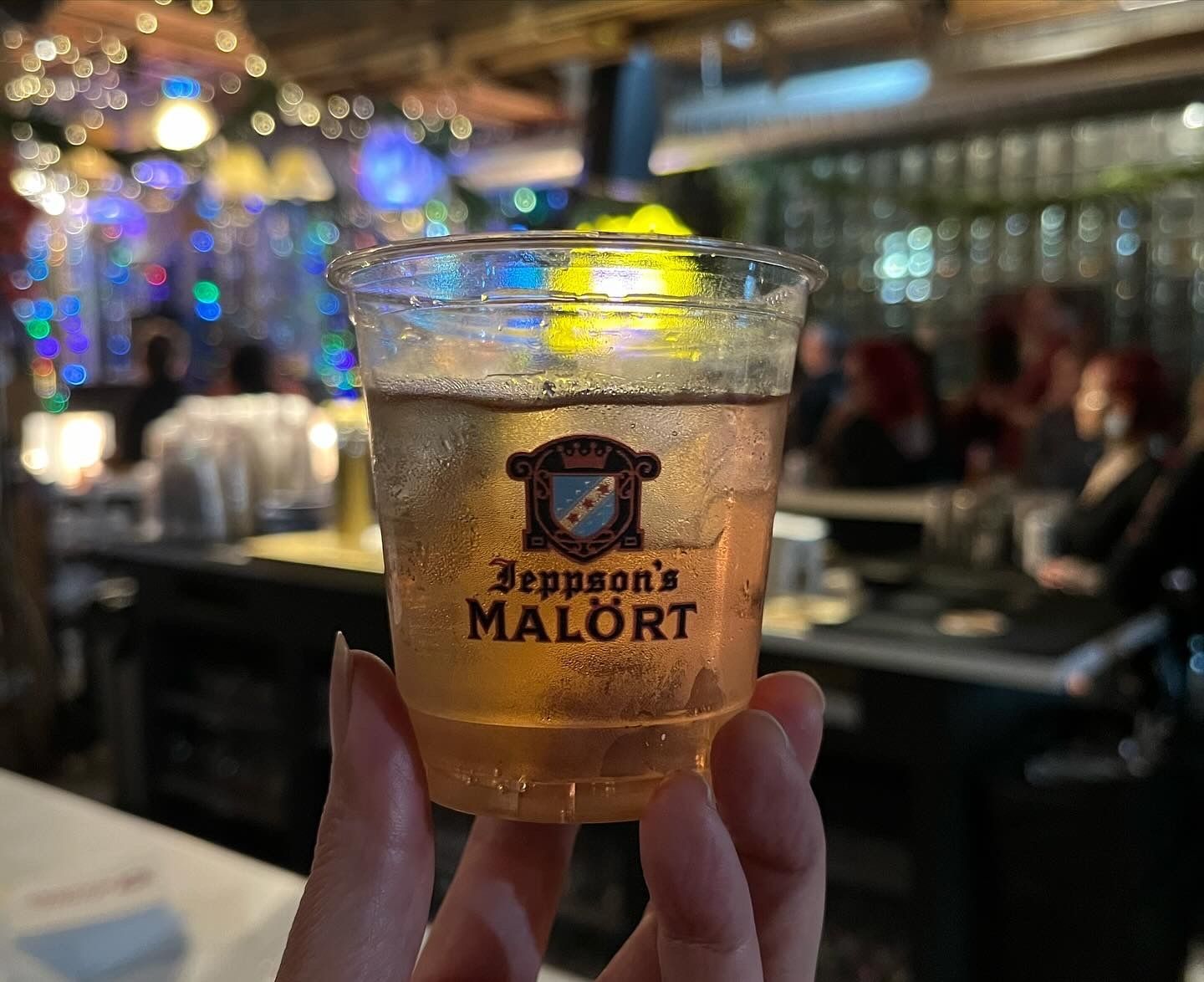 A cup with liquid and ice in it 