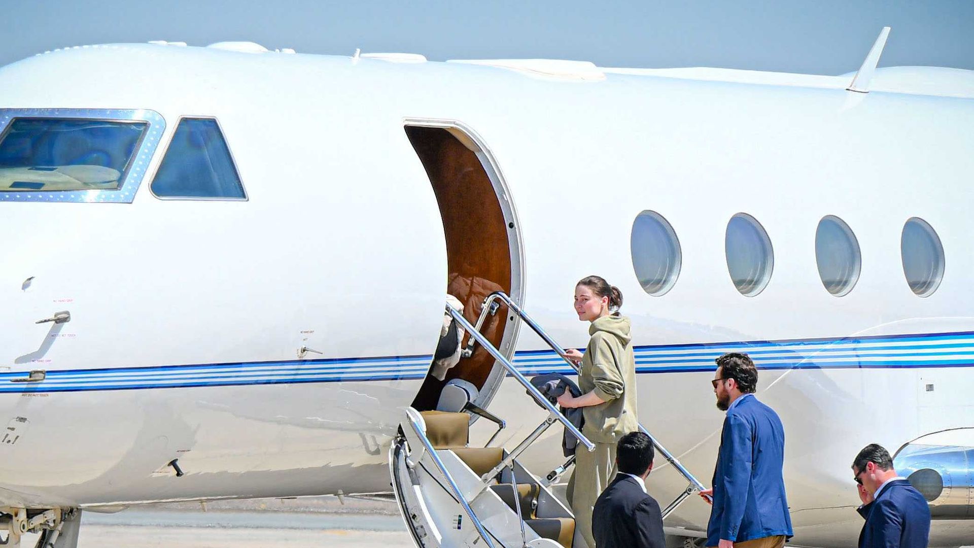 American citizen Ksenia Karelina, who was freed in a prisoner swap with Russia, seen boarding a plane in the UAE. 
