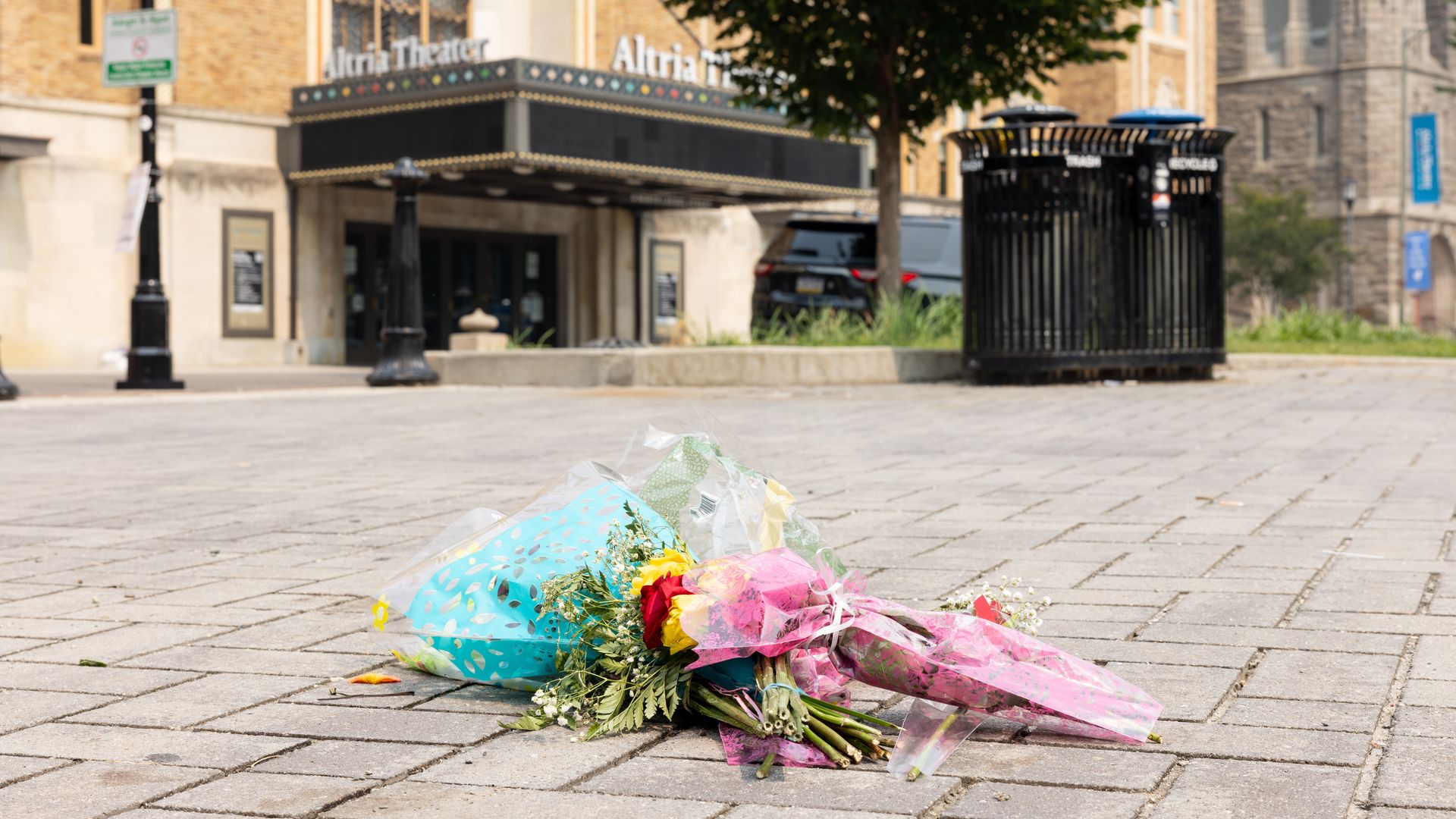 Flowers left at the site of a fatal shooting outside of the Altria Theater after the Huguenot High School graduation ceremony the previous day, in Richmond, Va., June 7, 2023. (Parker Michels-Boyce for The Washington Post via Getty Images)