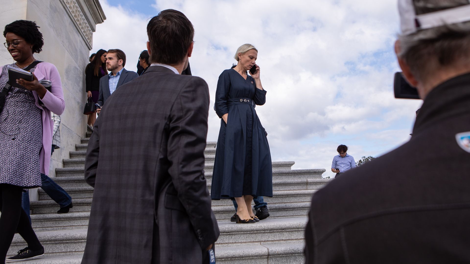 Representative Victoria Spartz speaks on a smartphone while departing the U.S. Capitol on Saturday.