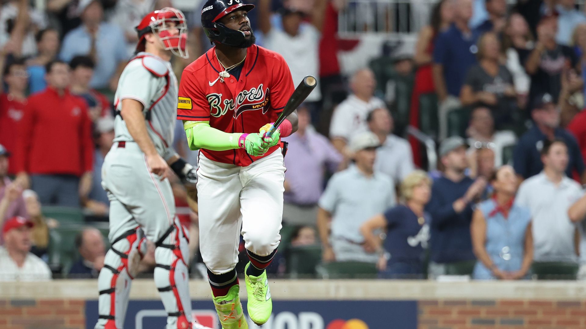 The Braves' Michael Harris II watches as his three-run home run in the first inning spirals over the fence.