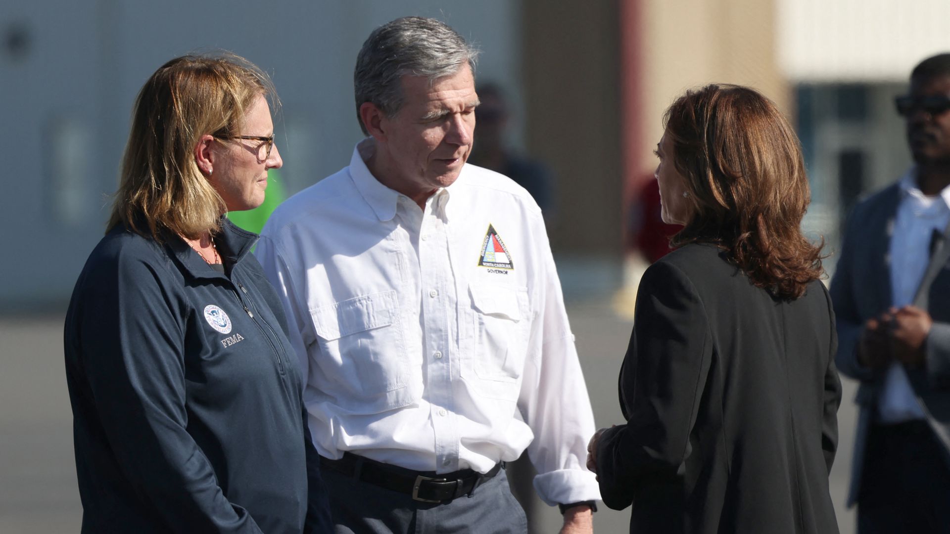 US Vice President Kamala Harris is greeted by North Carolina Governor Roy Cooper at airport