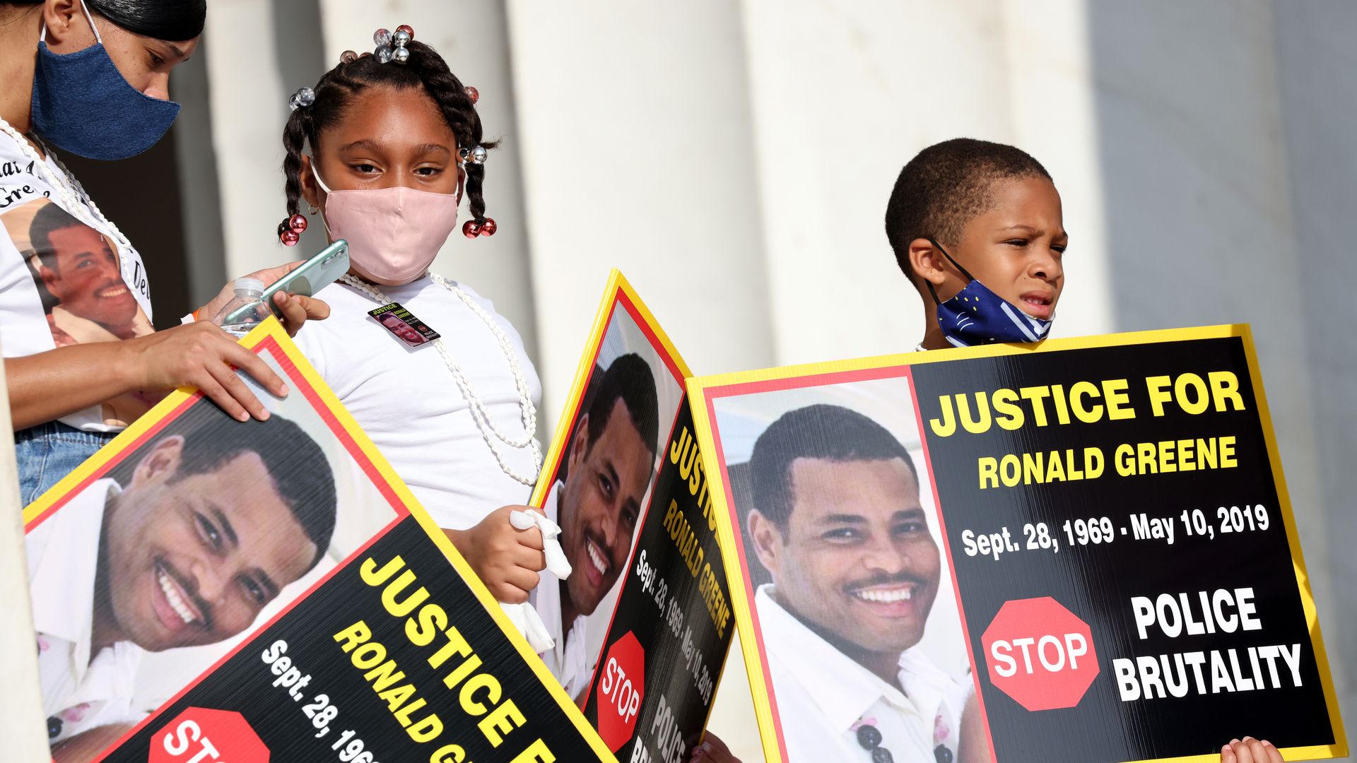 Family members of Ronald Greene listen to speakers as they gather at the Lincoln Memorial for the March on Washington August 28, 2020 in Washington, DC. 