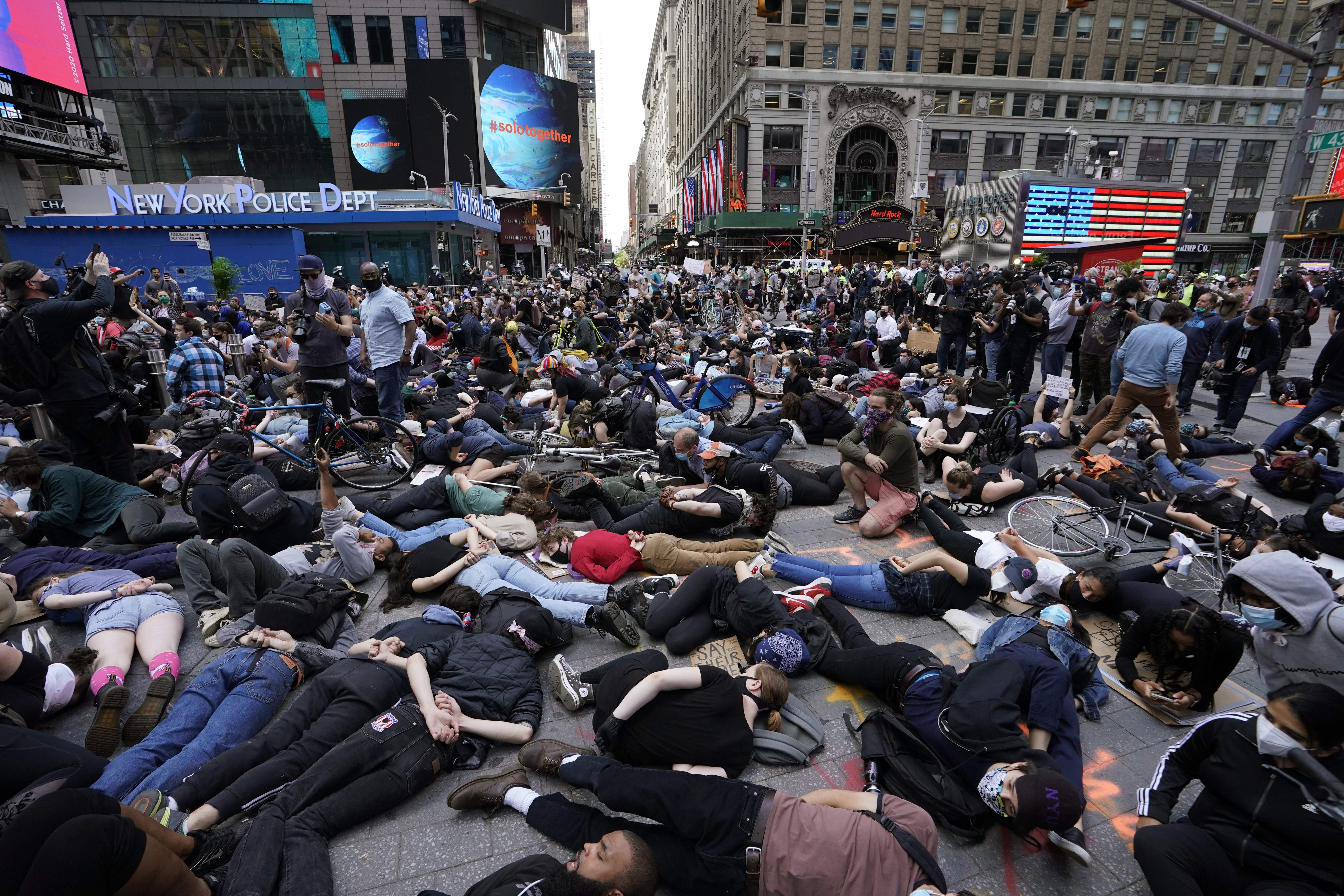 Protestors lay on the ground with their hands behind their back in a call for justice for George Floyd in Times Square on June 1, 2020