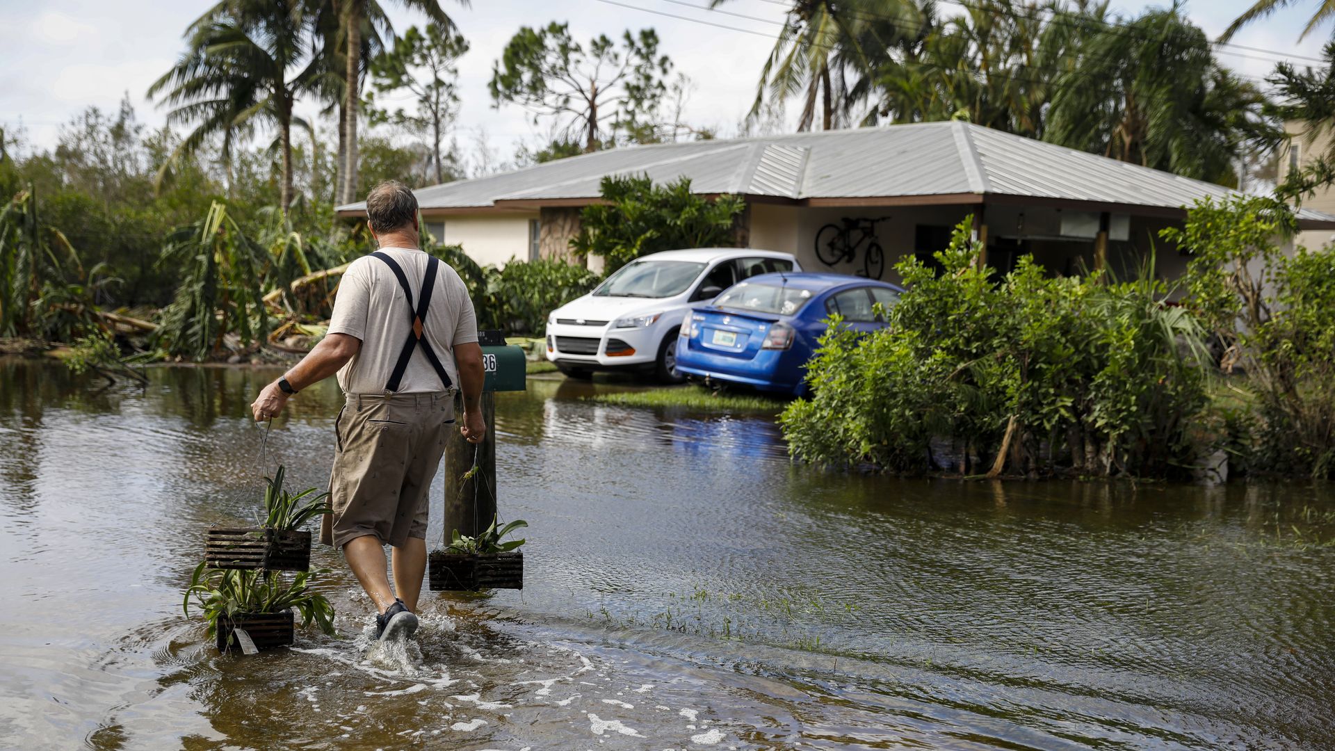 Resident walking through water in their home