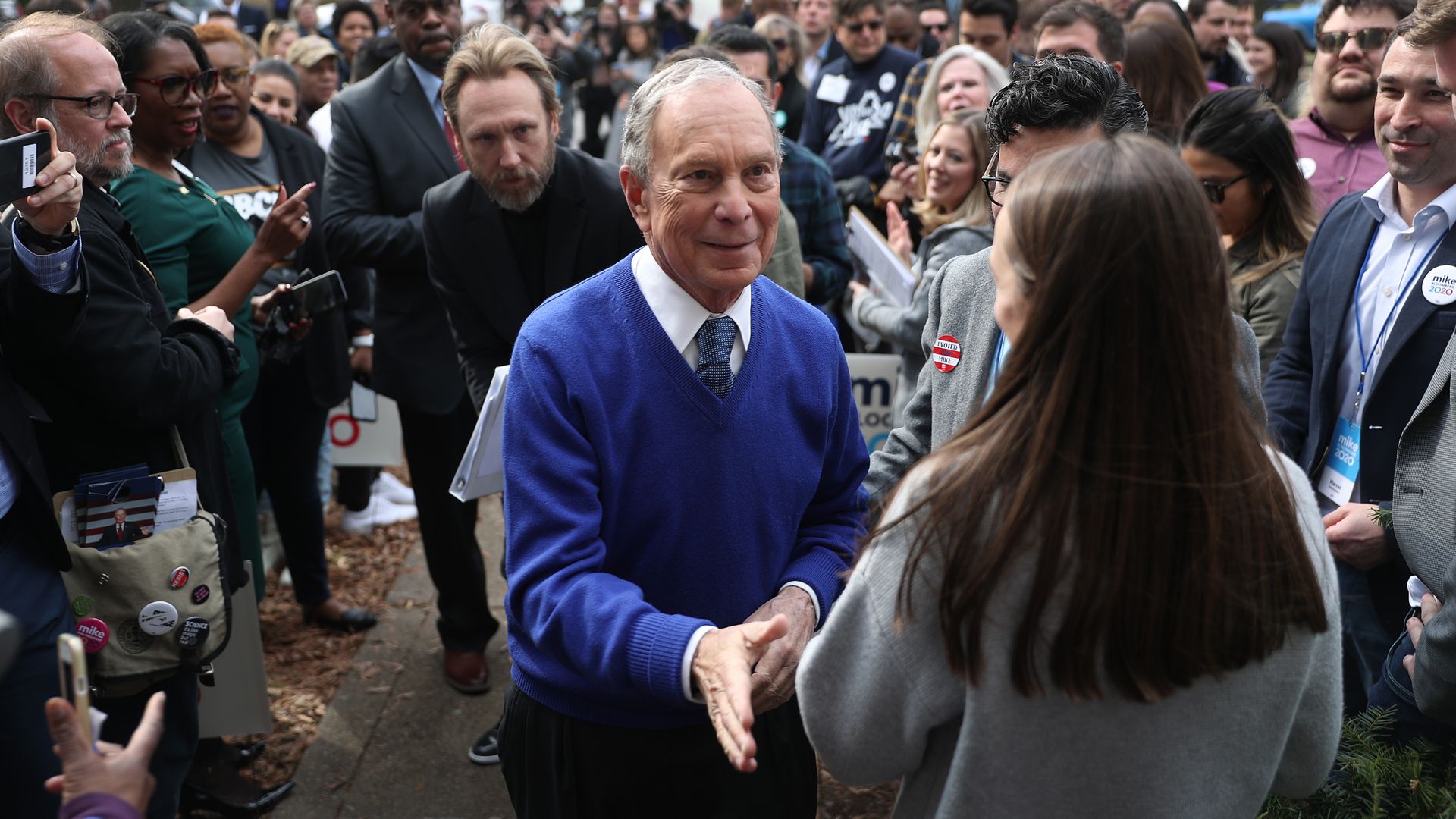 Mike Bloomberg greets supporters during a stop at one of his campaign offices in Manassas, VA