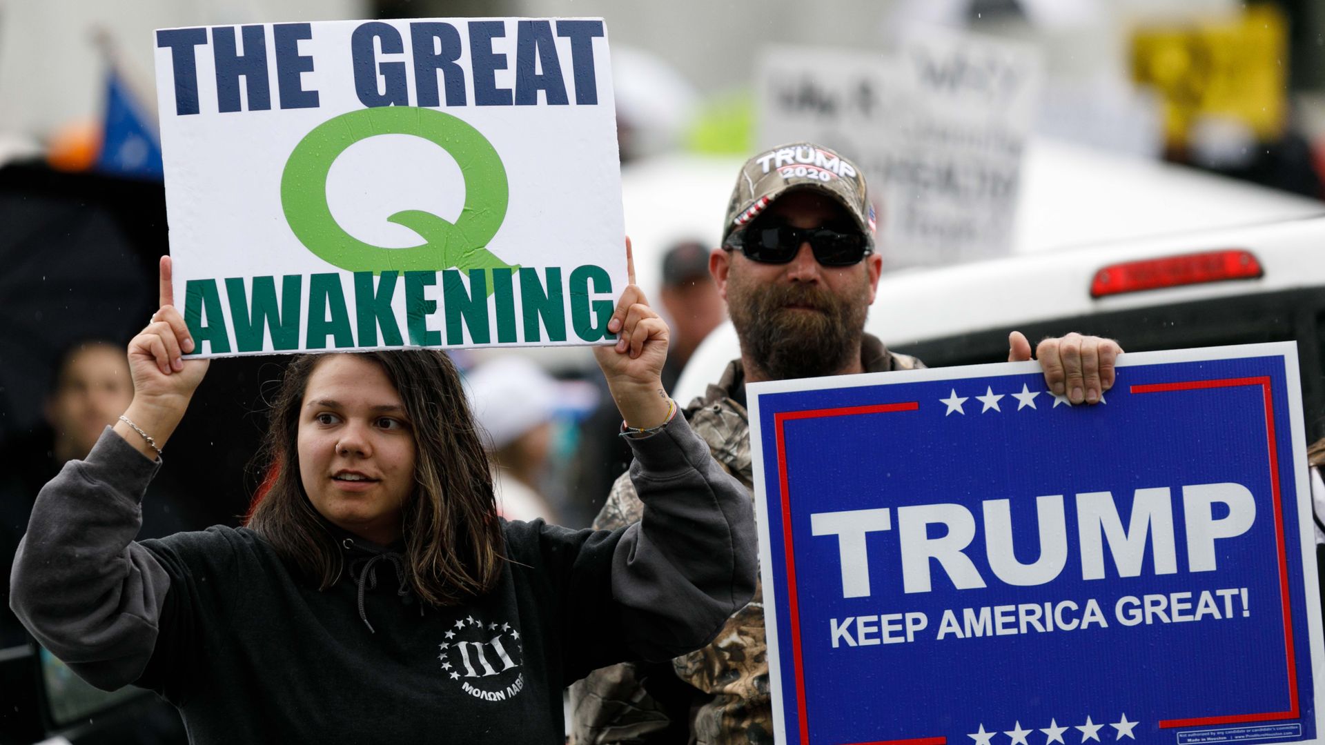 Trump supporters holding QAnon sign. Photo: John Rudoff/Anadolu Agency via Getty Images