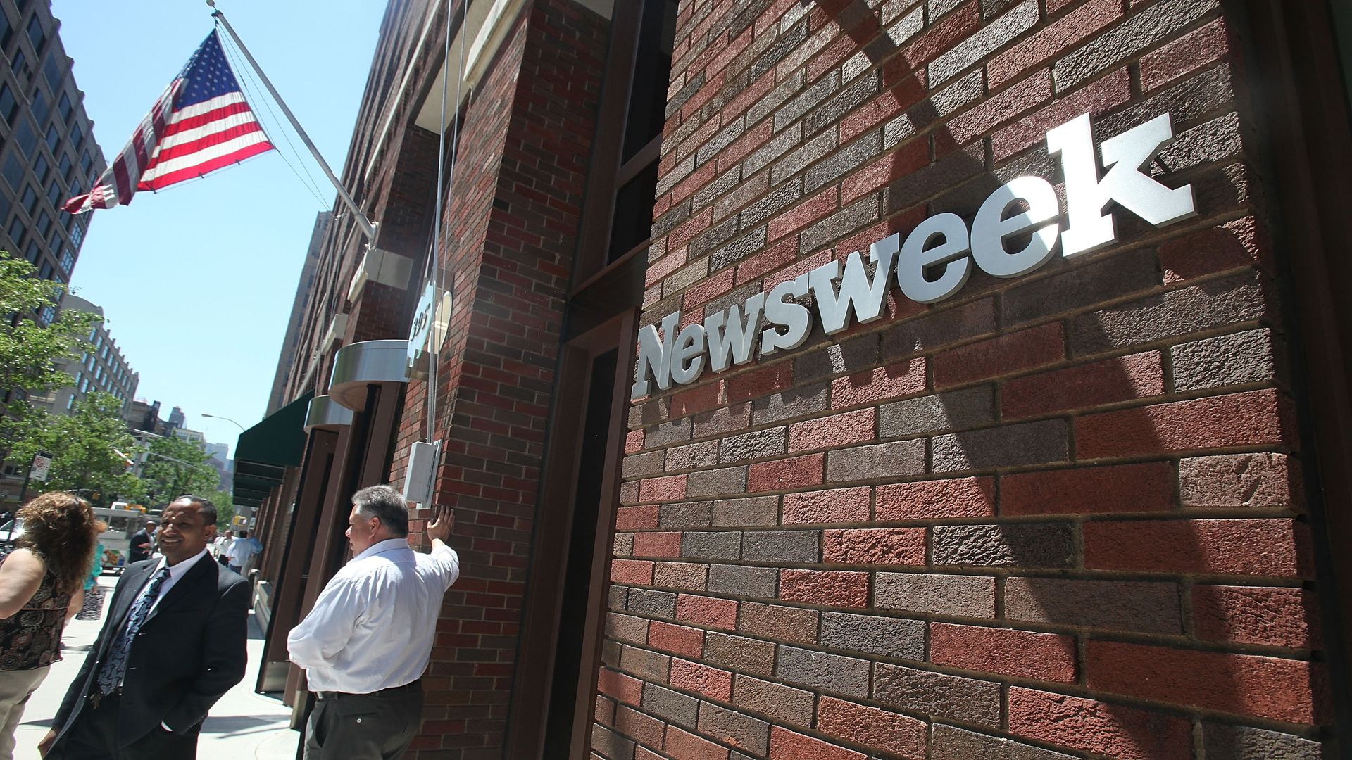 A sign bearing the Newsweek logo