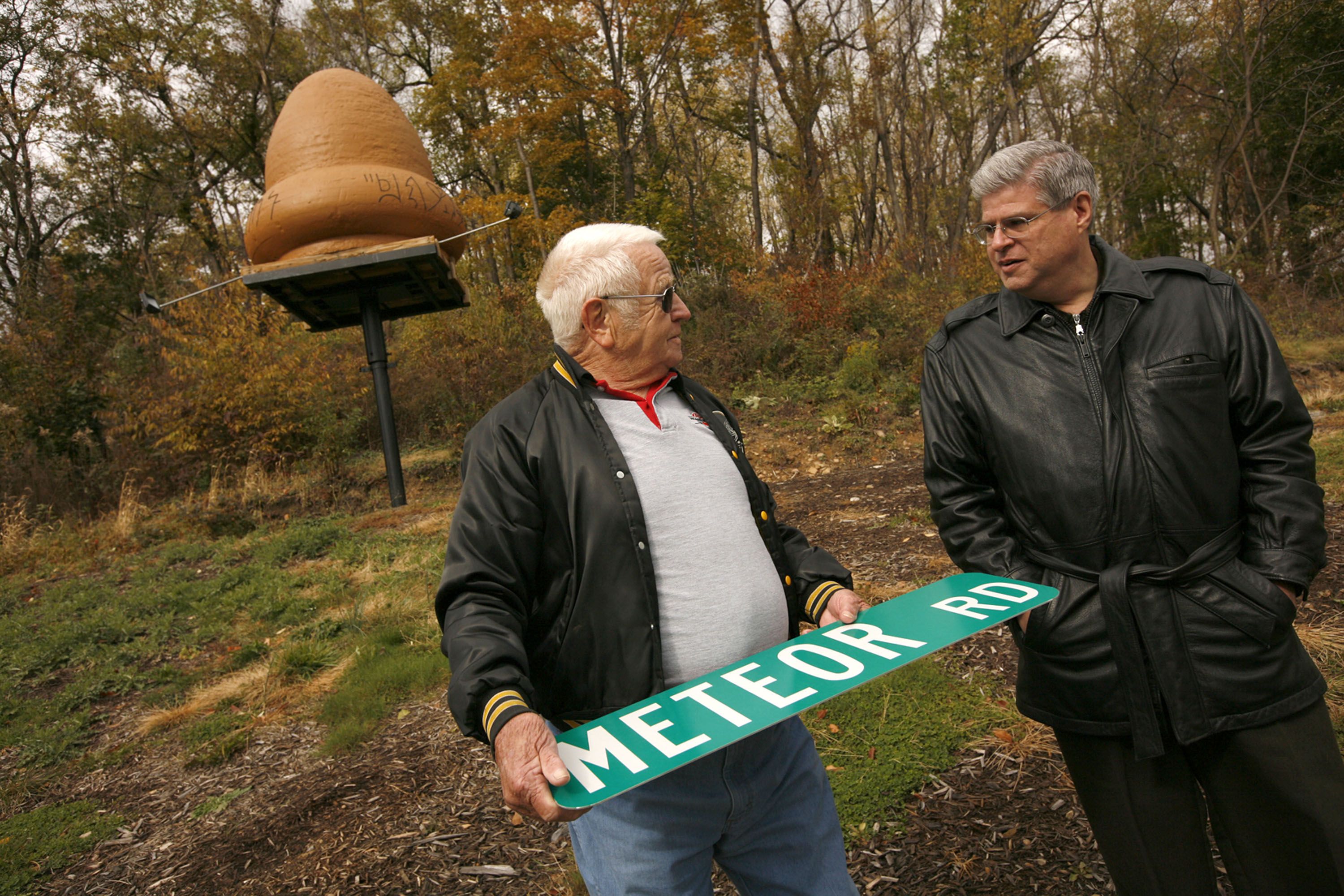 Bill Bulebush, left, and UFO expert Stan Gordon stand near where some say a UFO landed in Kecksburg. Photo: Annie O'Neill/Chicago Tribune via Getty Images