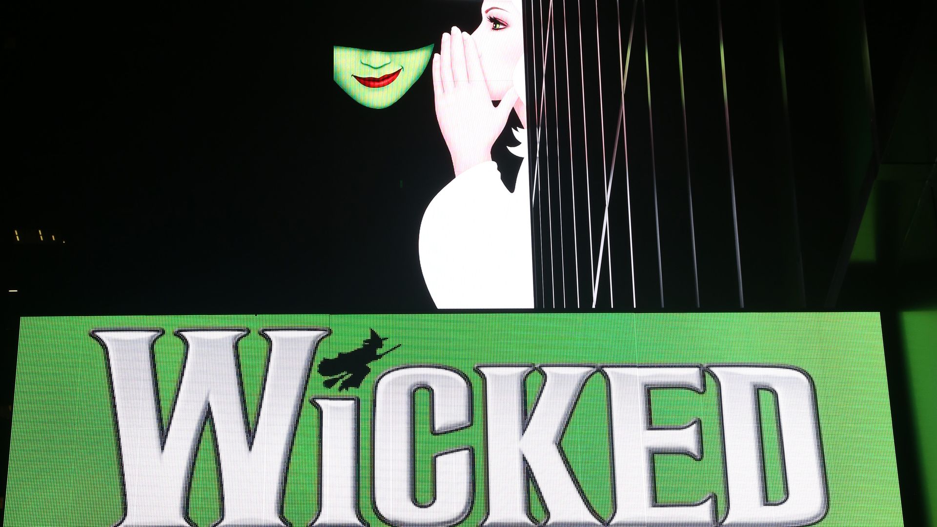 A sign advertising the musical "Wicked."