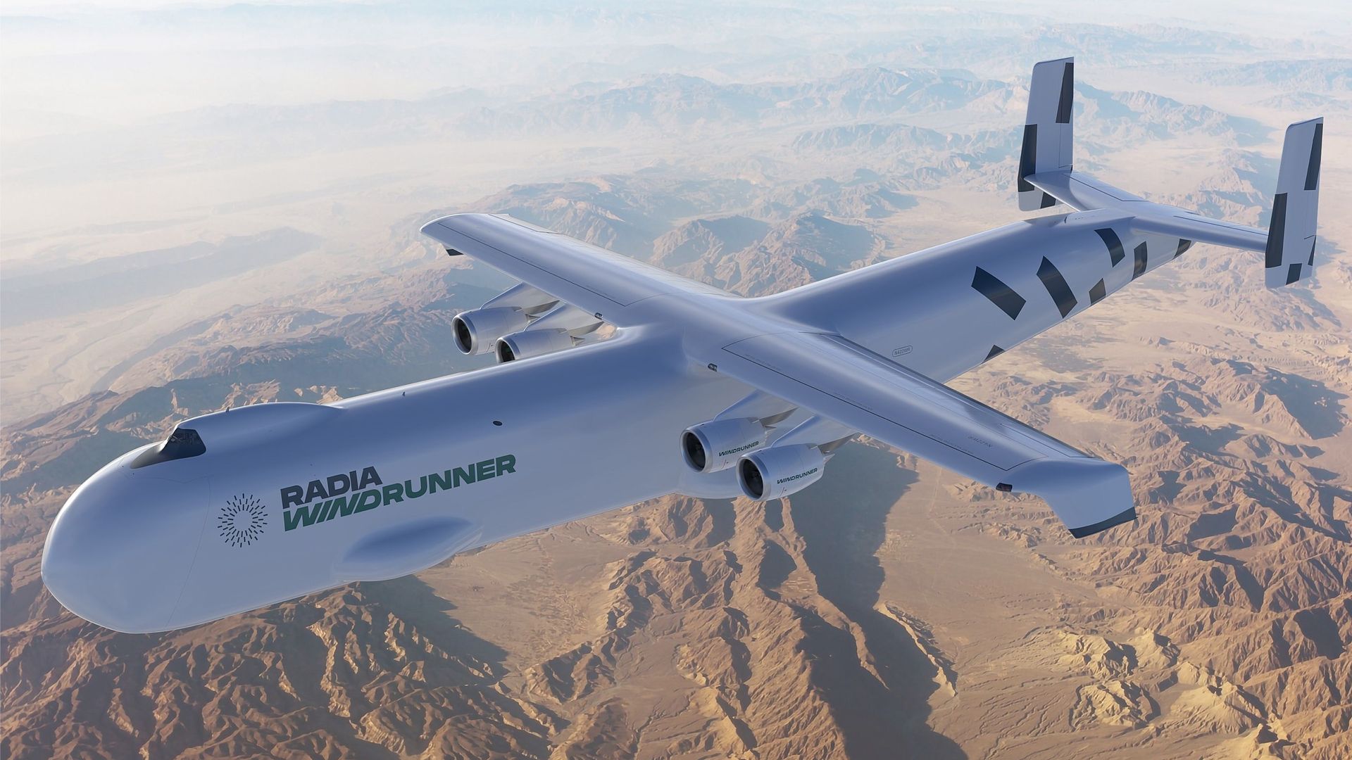 A rendering depicts the enormous Radia WindRunner aircraft, flying over a desert landscape.