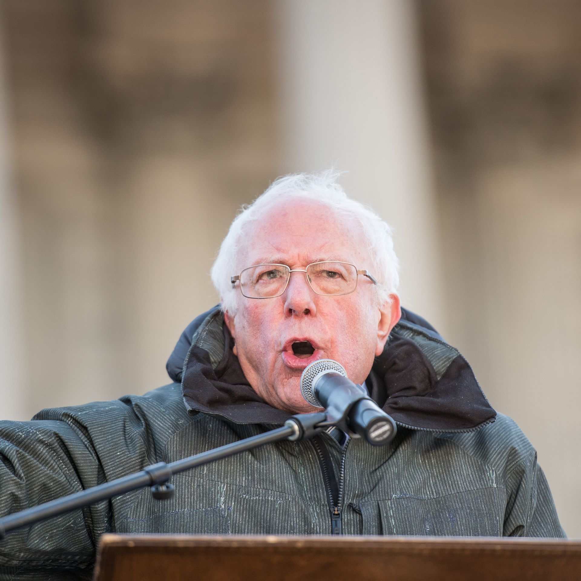 Bernie Sanders speaks at a podium