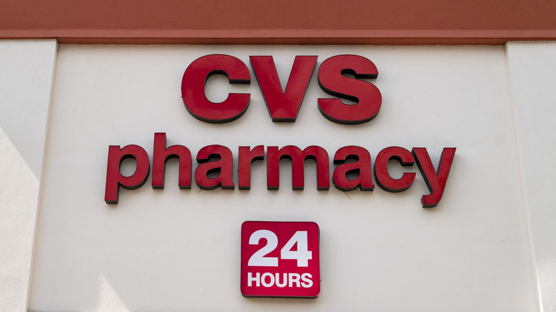 This image shows a CVS pharmacy sign that also says "24 hours"