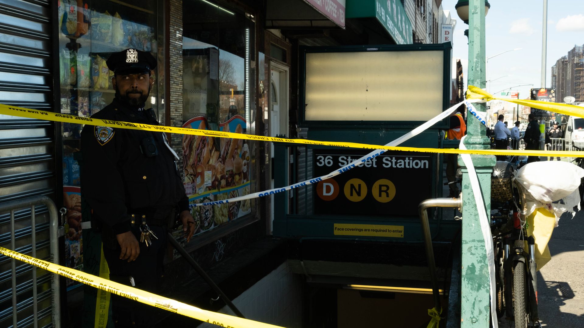 A police officer outside of the 36th Street Subway Station on April 12 in Brooklyn, New York City.