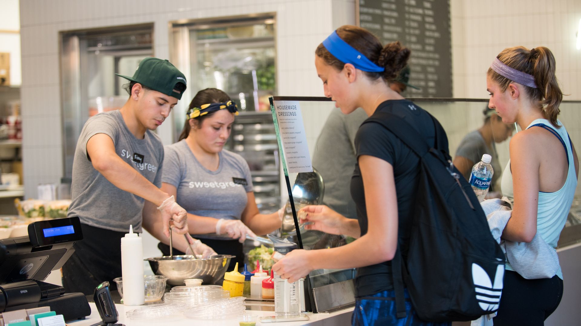 Customers ordering salads at Sweetgreen