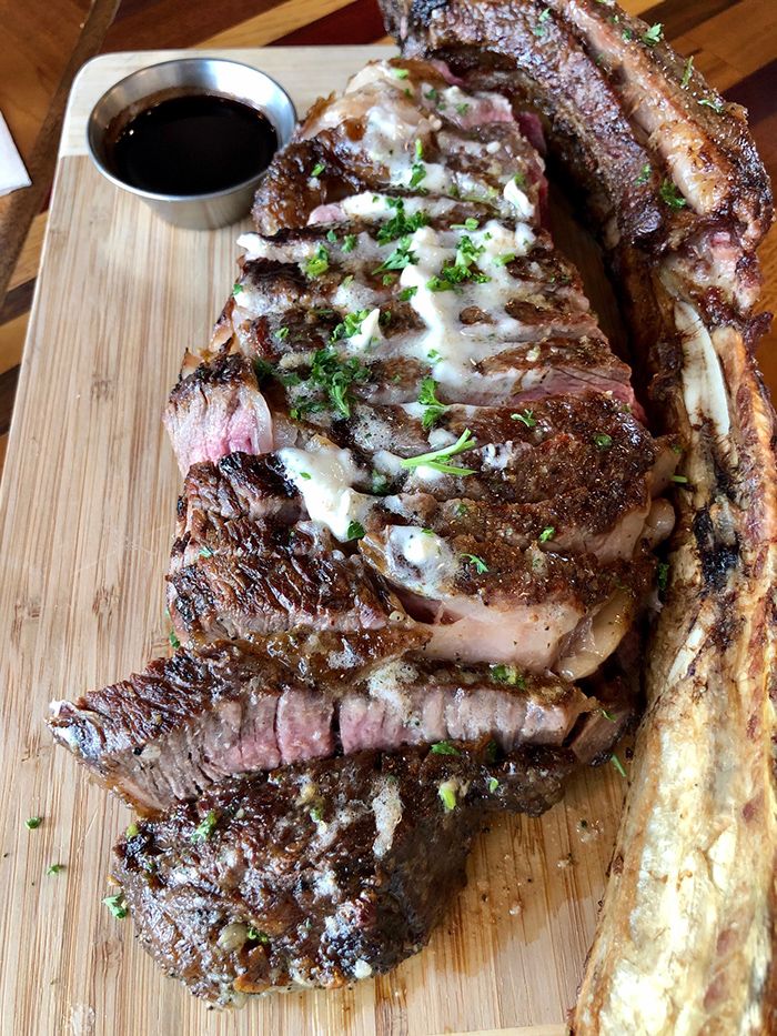 tomahawk new york ribeye sliced at butcher shoppe