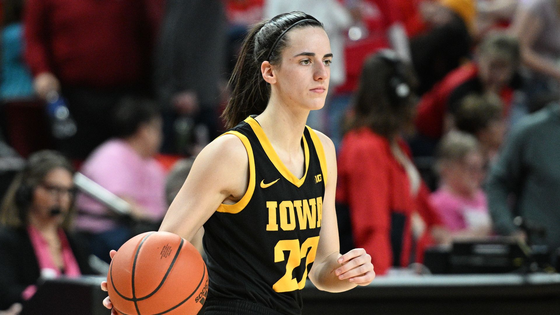 Caitlin Clark with a basketball