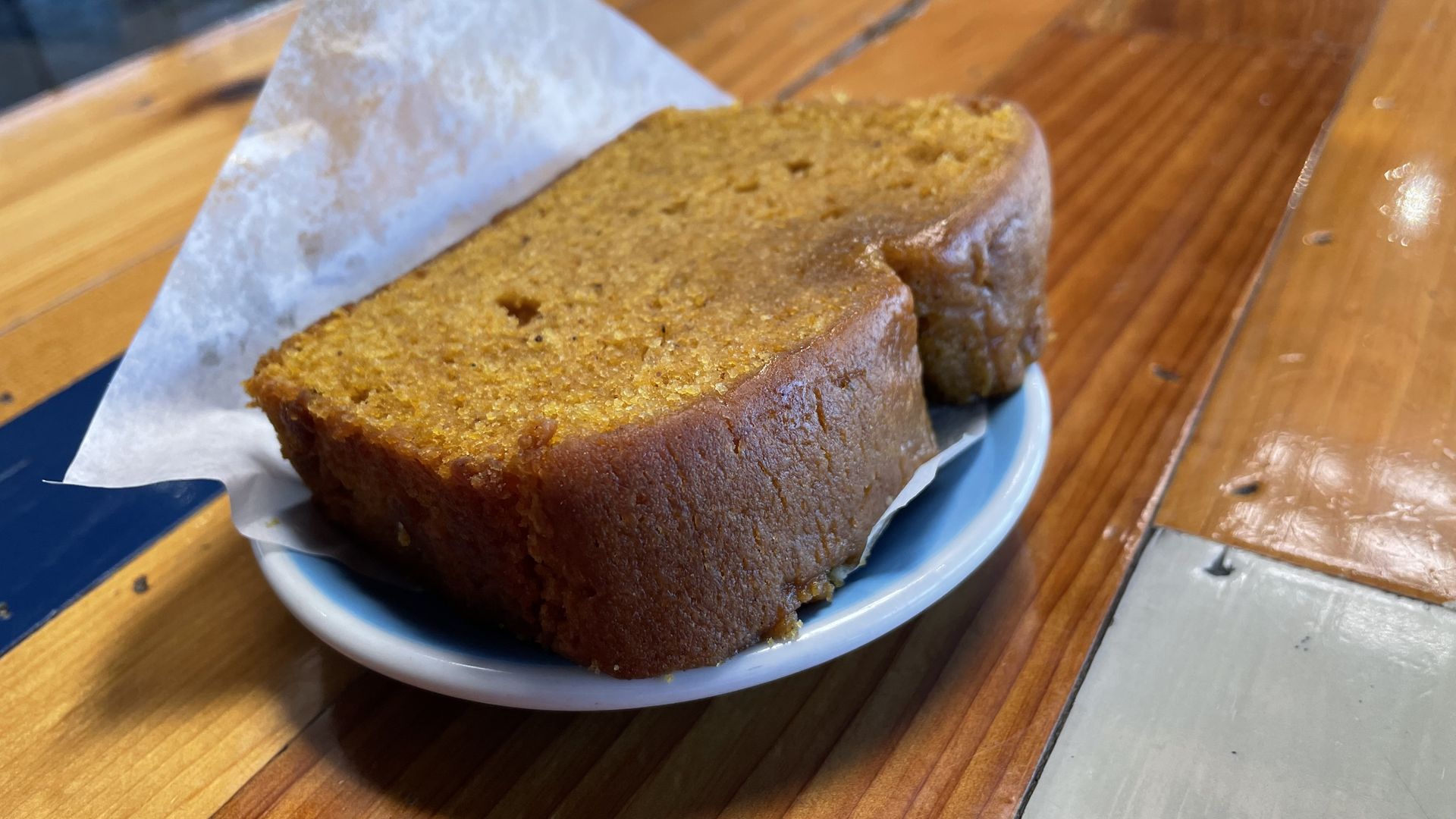 A slice of pumpkin bread on a plate 