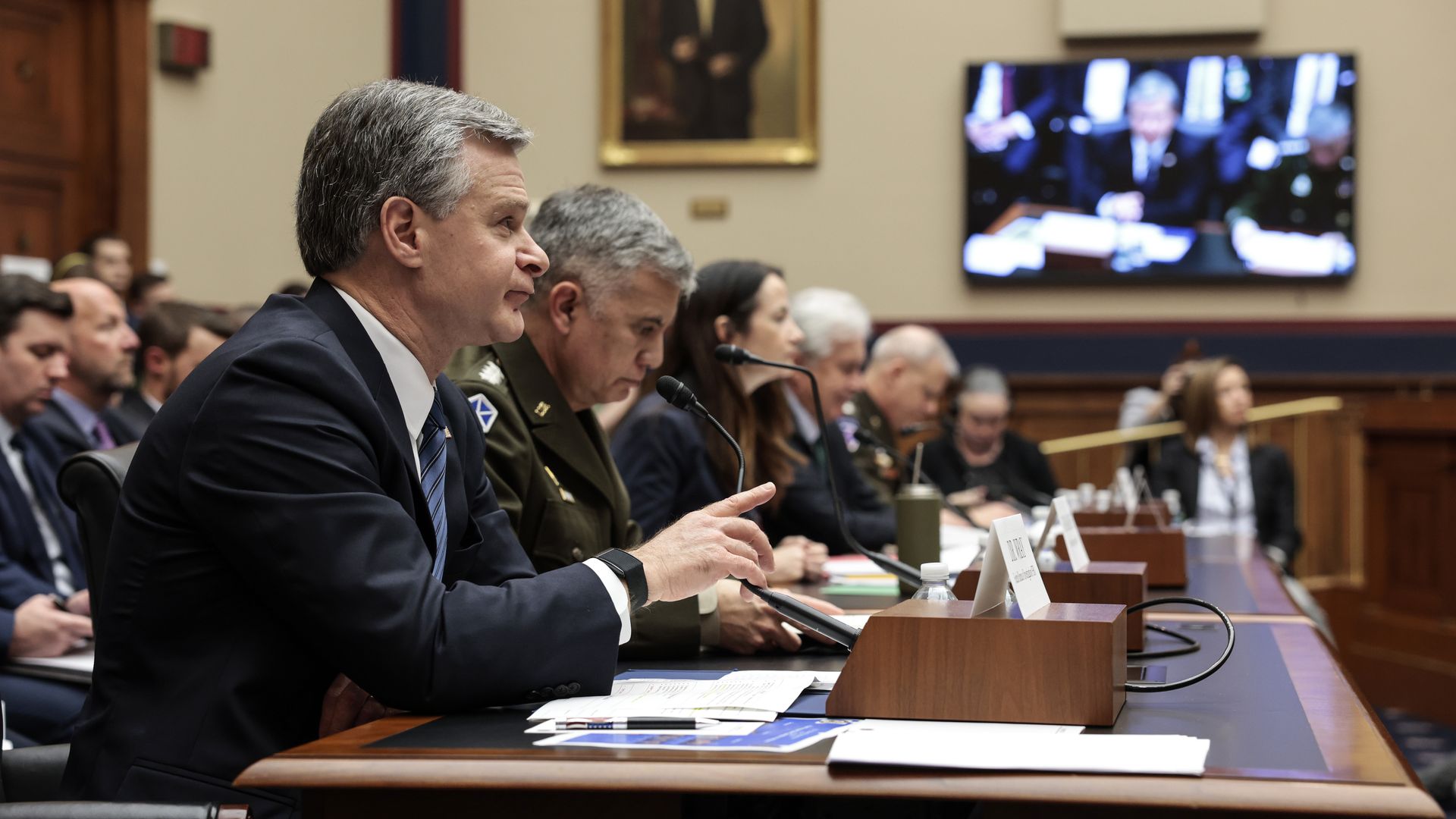 FBI Director Christopher Wray is seen testifying before the House.