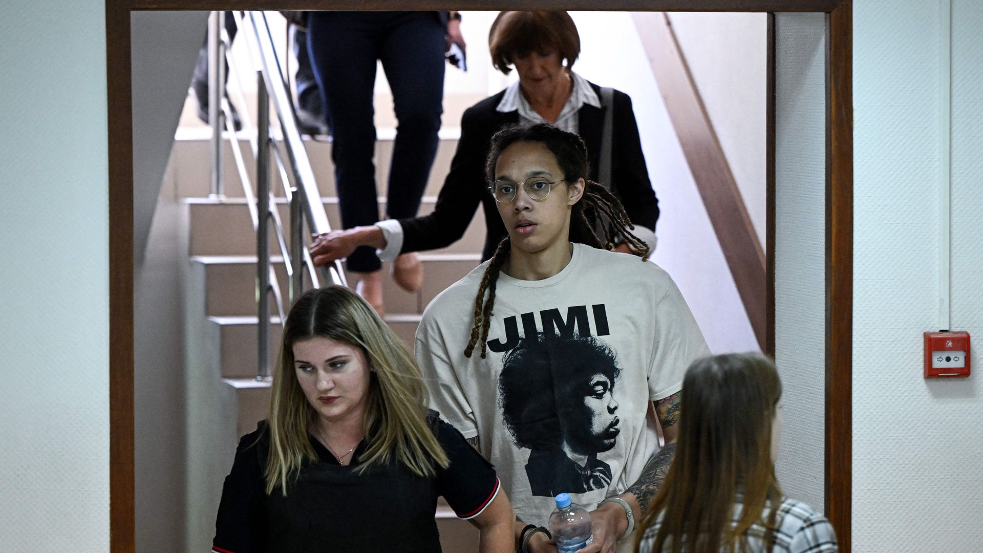 Brittney Griner (C) arrives to a hearing at the Khimki Court, outside Moscow on July 1