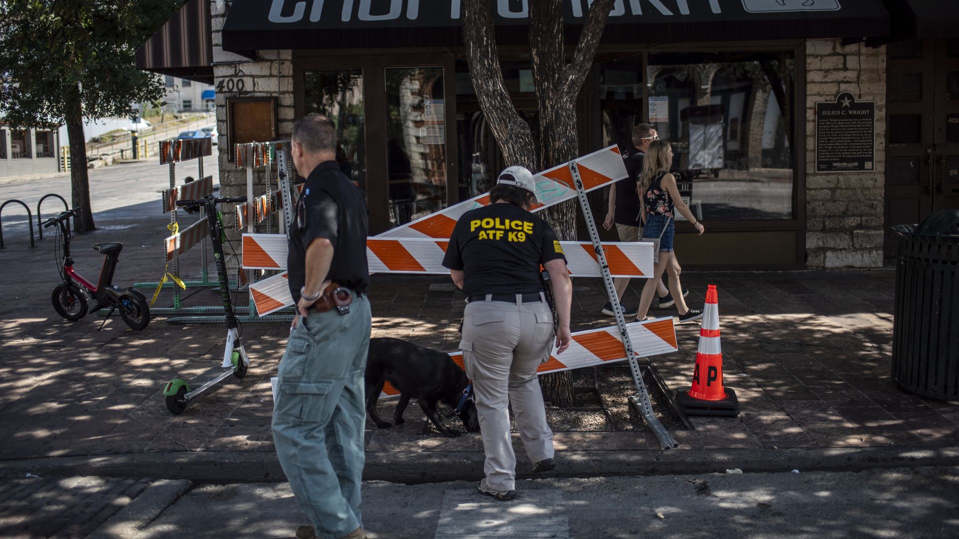 An ATF K9 unit surveys the area near the scene of a shooting on June 12, 2021 in Austin, Texas
