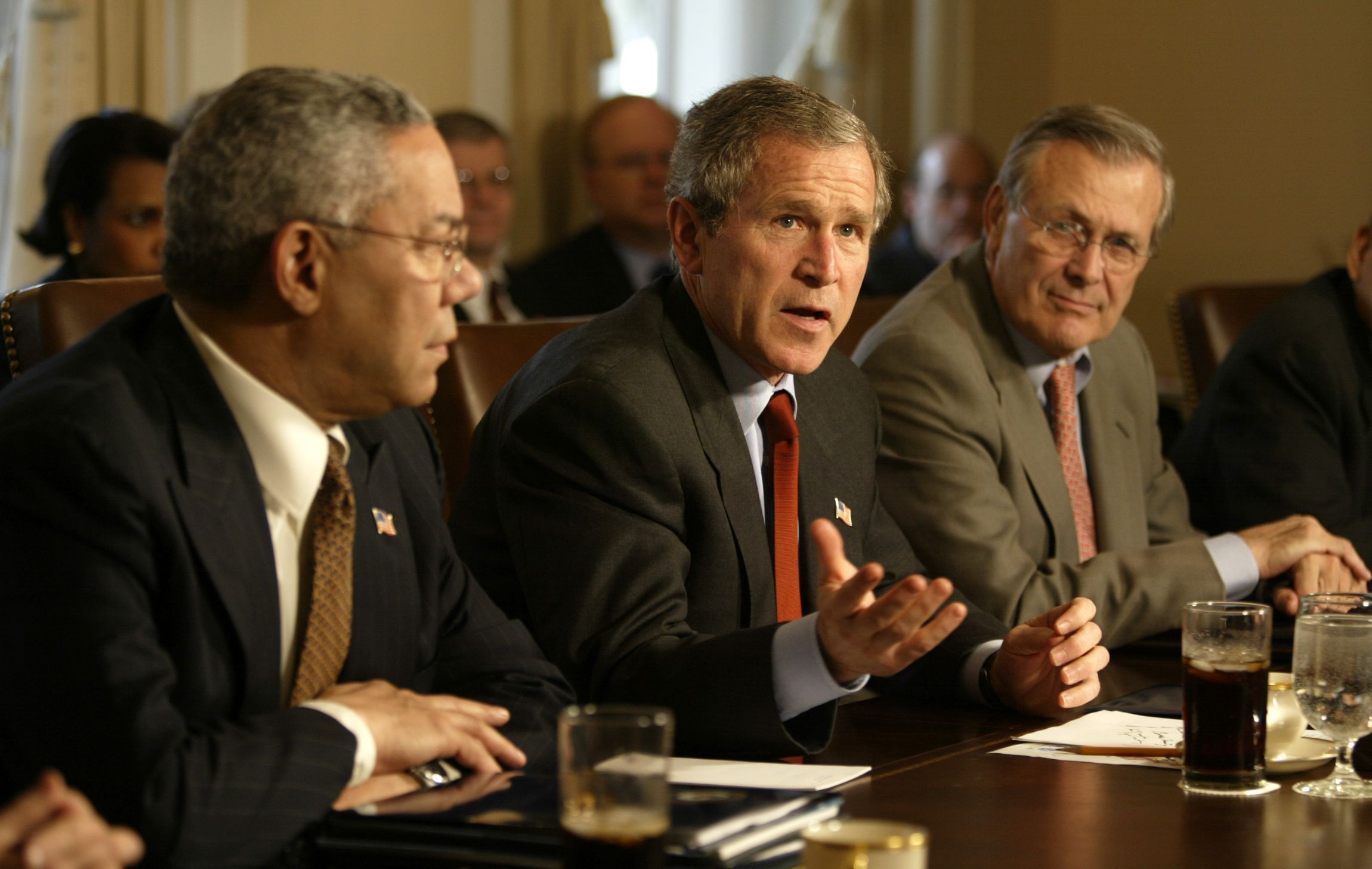 Then-President George W. Bush meets with his cabinet at the White House, including Secretary of State Colin Powell (L) and Secretary of Defense Donald Rumsfeld in 2002. 