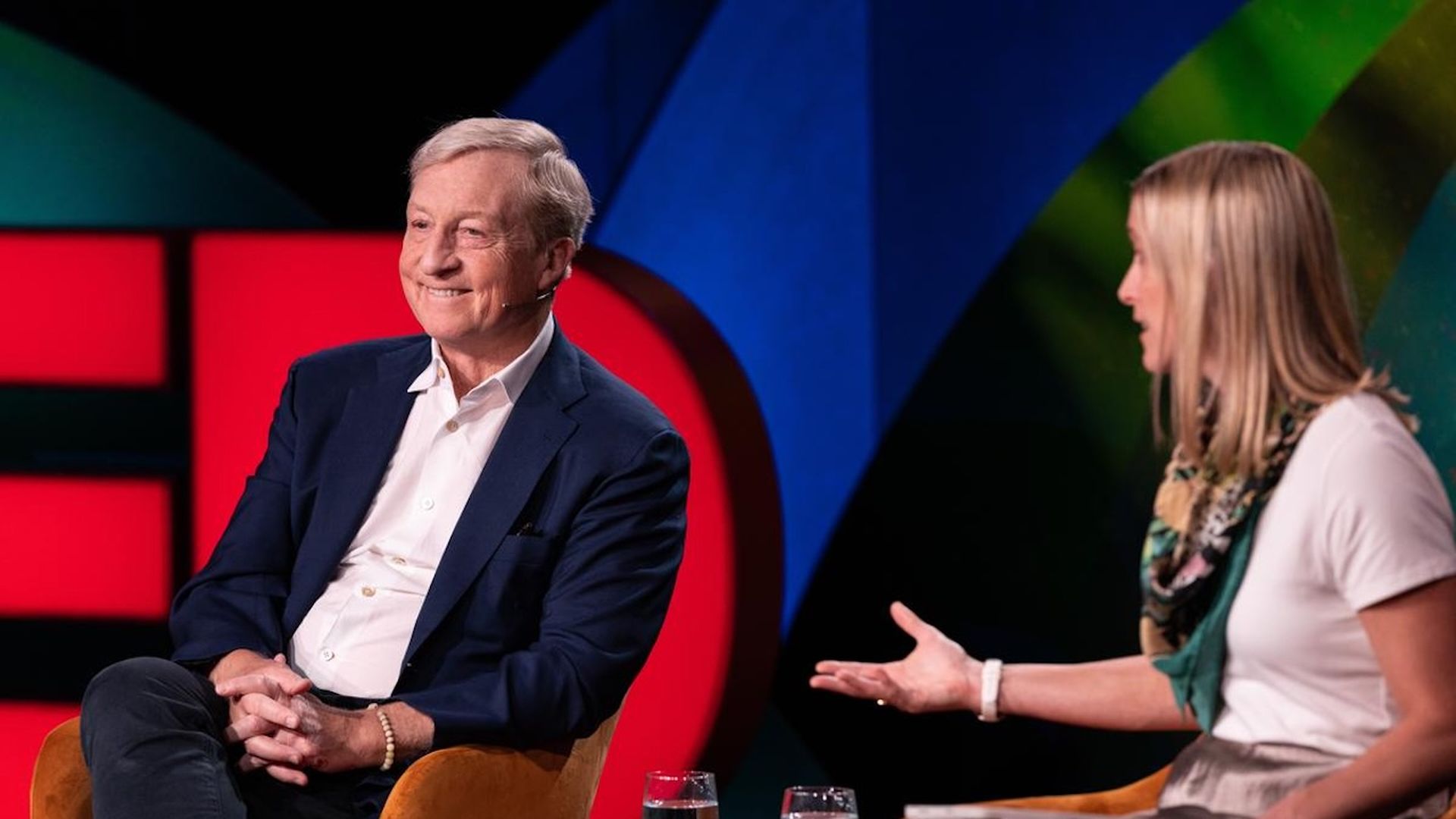 Photo of Amy Harder interviewing Tom Steyer