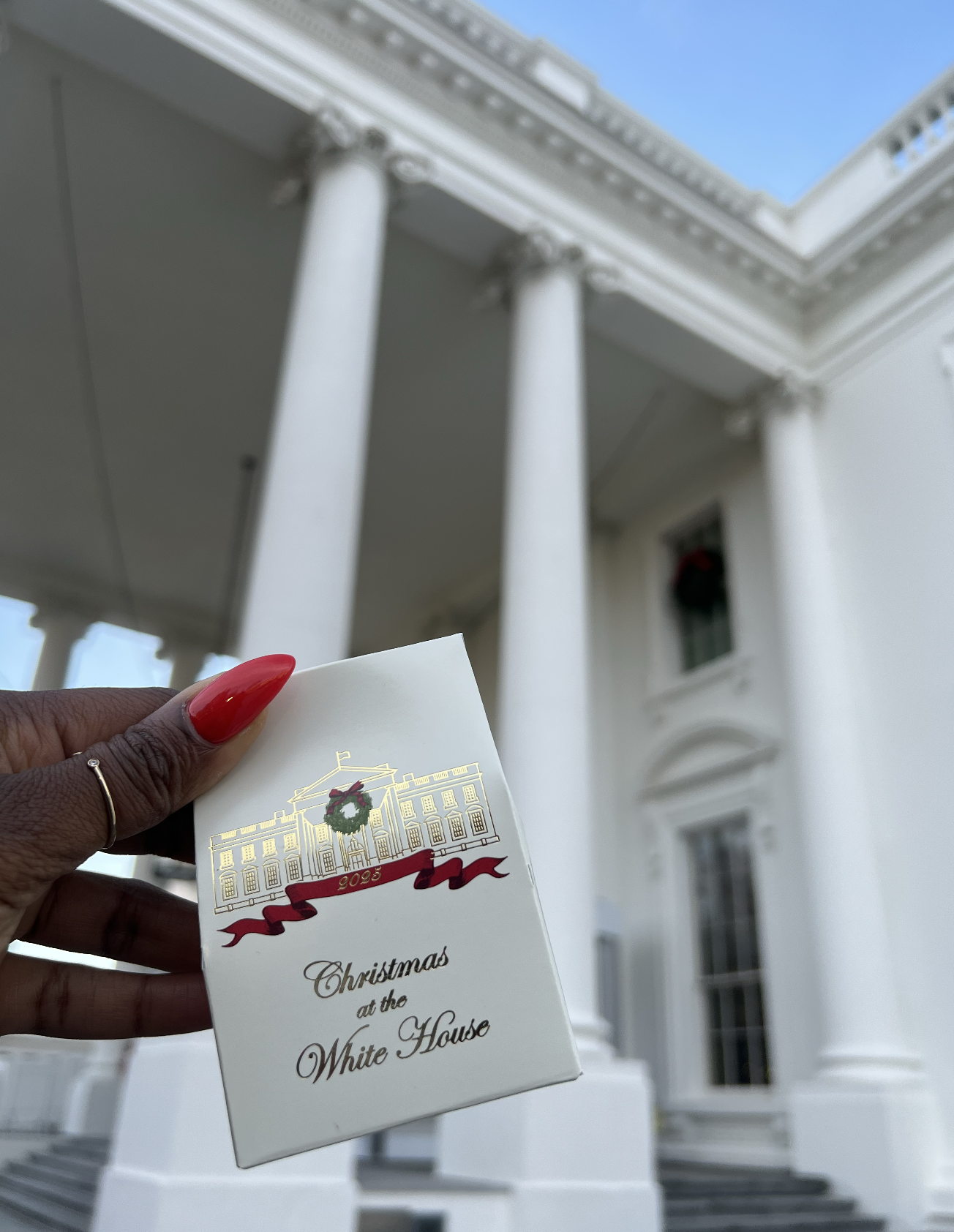 A box of candy held in front of the White House
