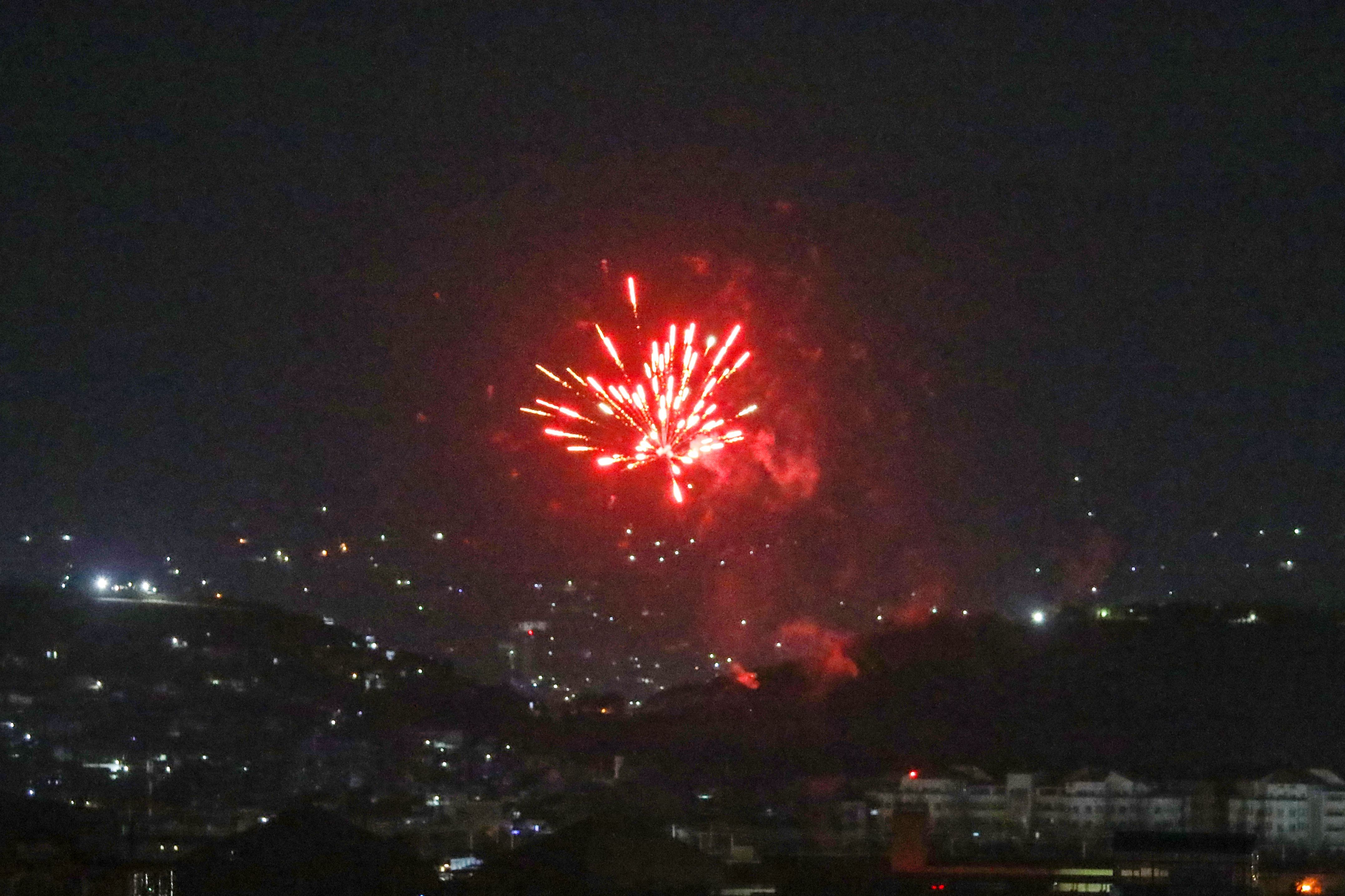 Fireworks light up part of the night sky after the last US aircraft took off from the airport in Kabul early on August 31