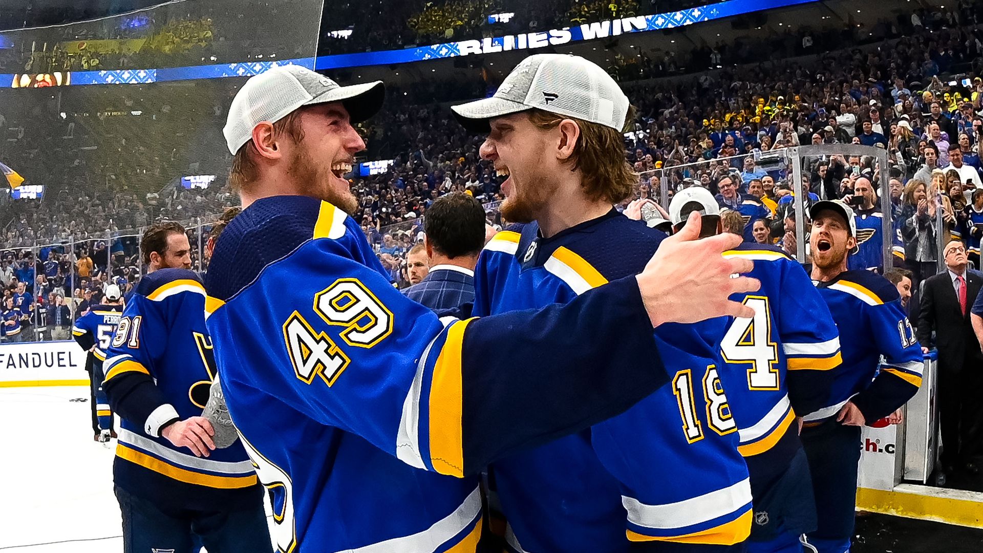 Blues players hugging each other