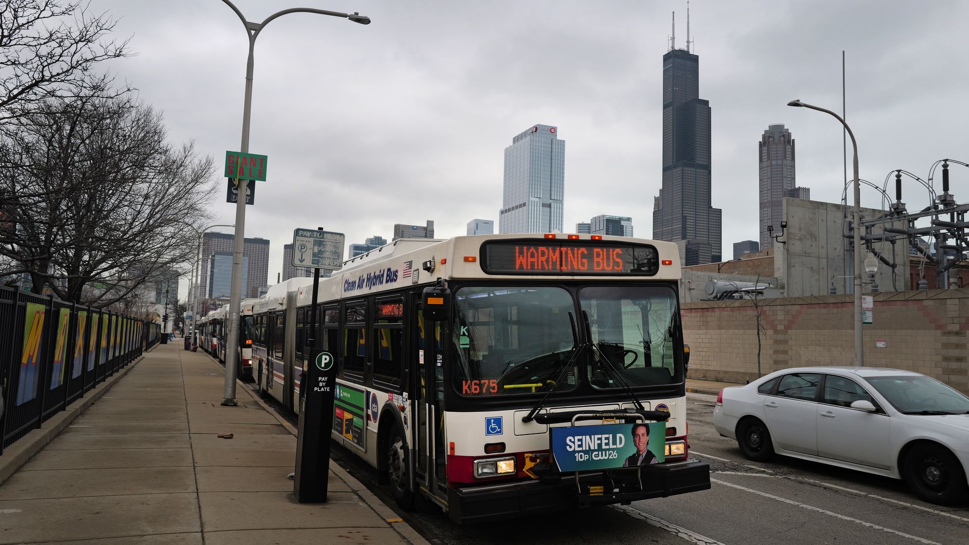Photo of a bus parked that says "Warming Bus" 
