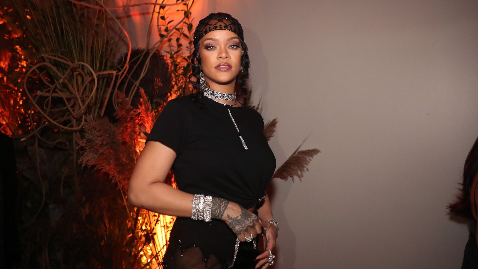 Rihanna poses for a photo.