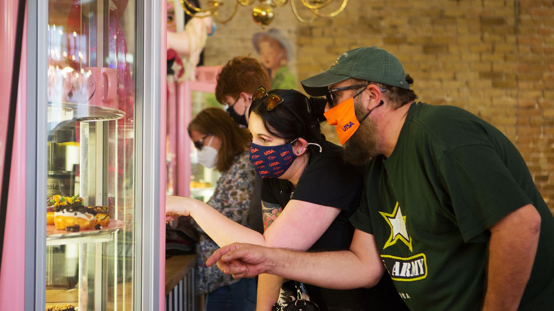 Customers examine doughnuts at an Austin shop