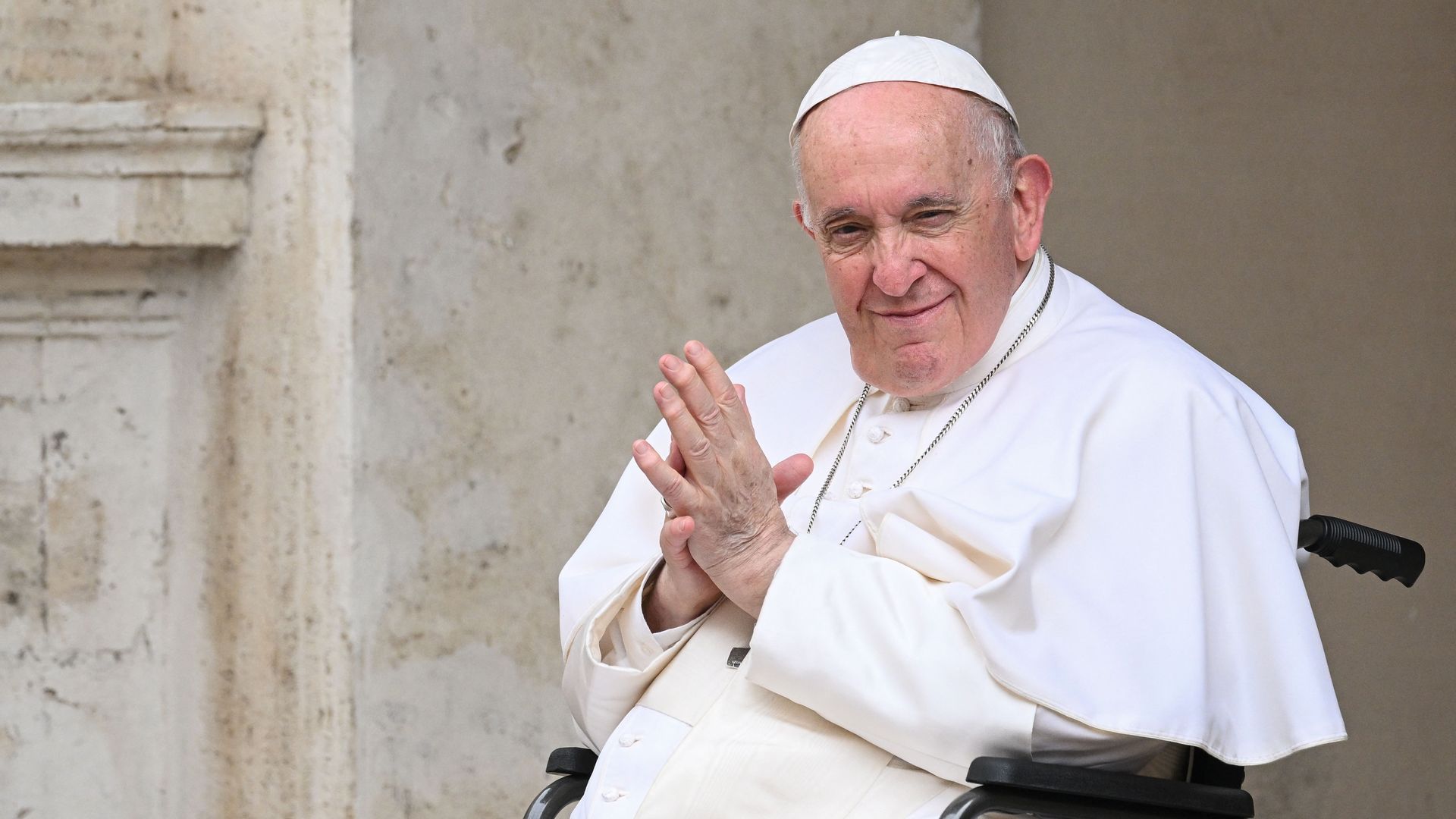 Pope Francis, seated in a wheelchair following knee treatment, on June 4, 2022 at San Damaso courtyard in The Vatican.