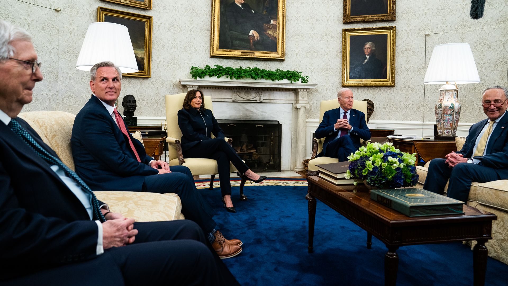 US President Joe Biden and Vice President Kamala Harris sit with House Speaker Kevin McCarthy, Minority Leader Mitch McConnell, and Senate Majority Leader Chuck Schumer in the Oval Office of the White House.