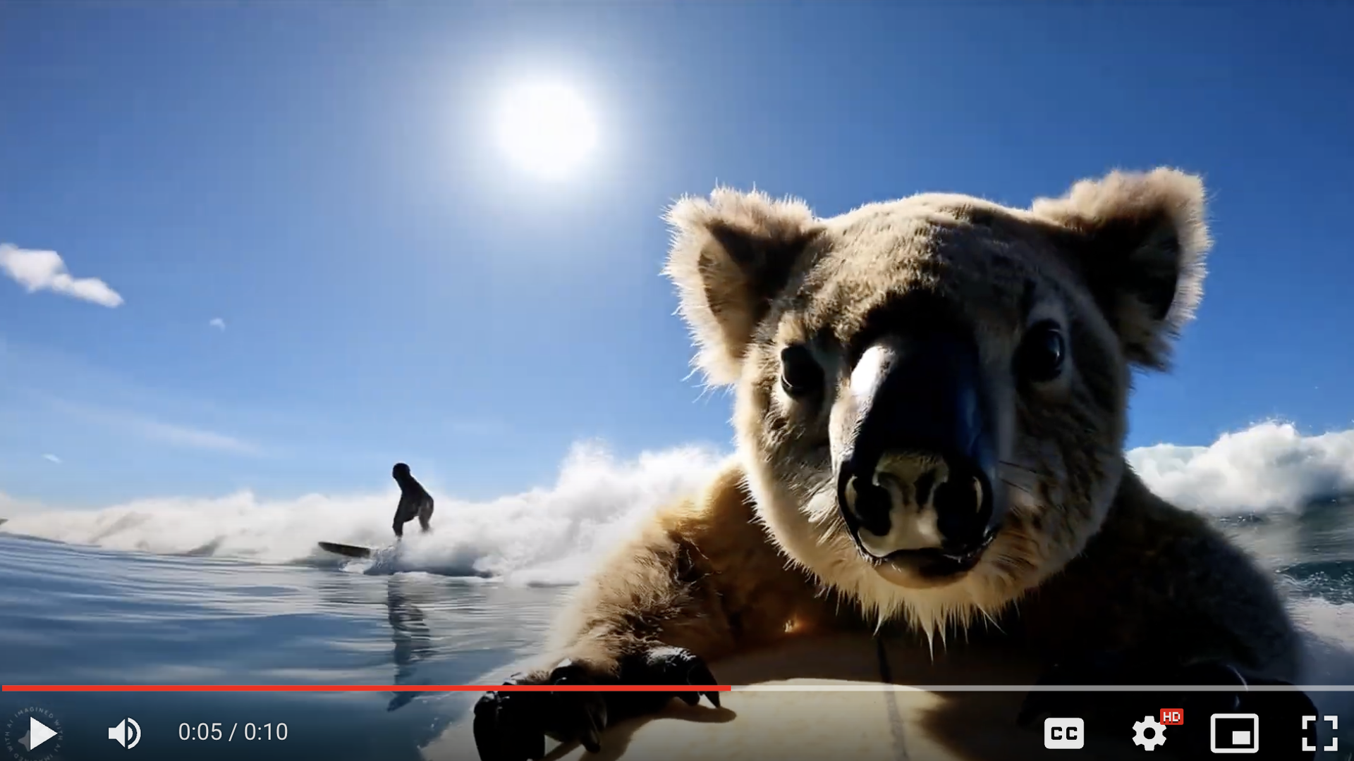 Video still of a Koala on a surfboard in the ocean
