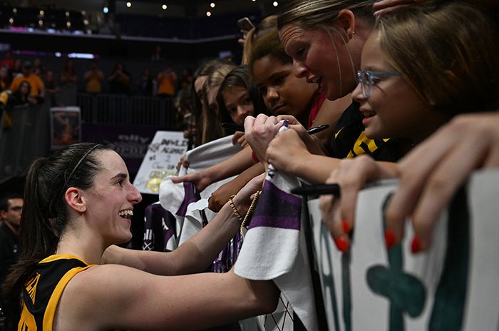 Caitlin Clark signs autographs after the game against Virginia Tech at Spectrum Center. Photo: G Fiume/Getty Images