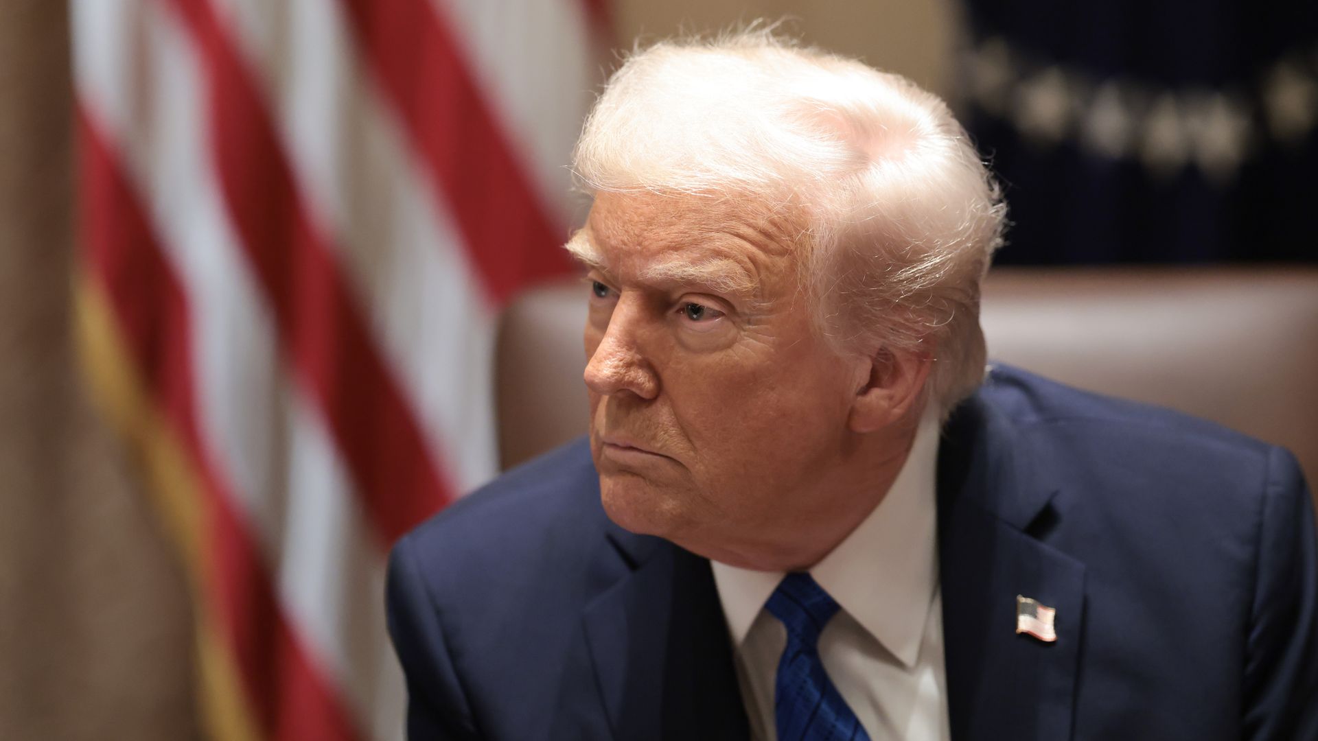 Trump looks on during a Ambassador meeting at the White House.