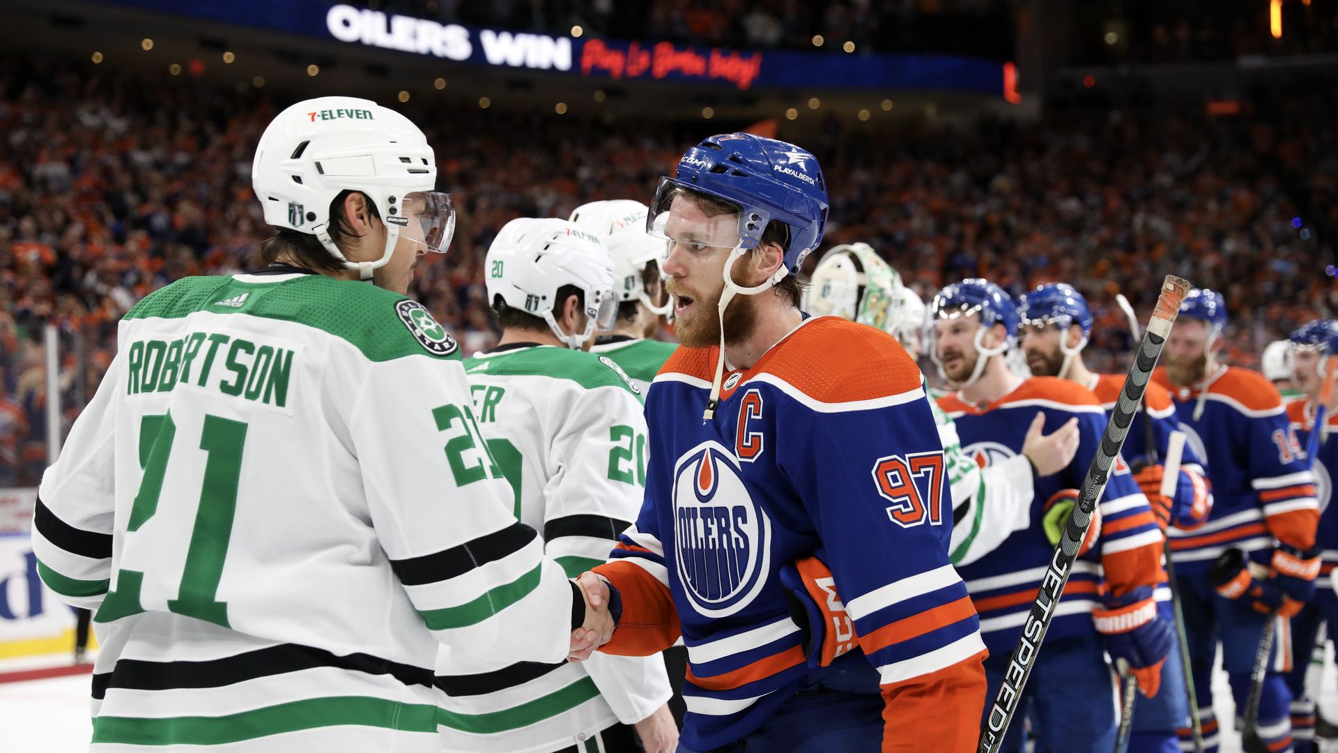 Jason Robertson and other Dallas Stars shake hands with the Edmonton Oilers after losing the Western Conference Finals
