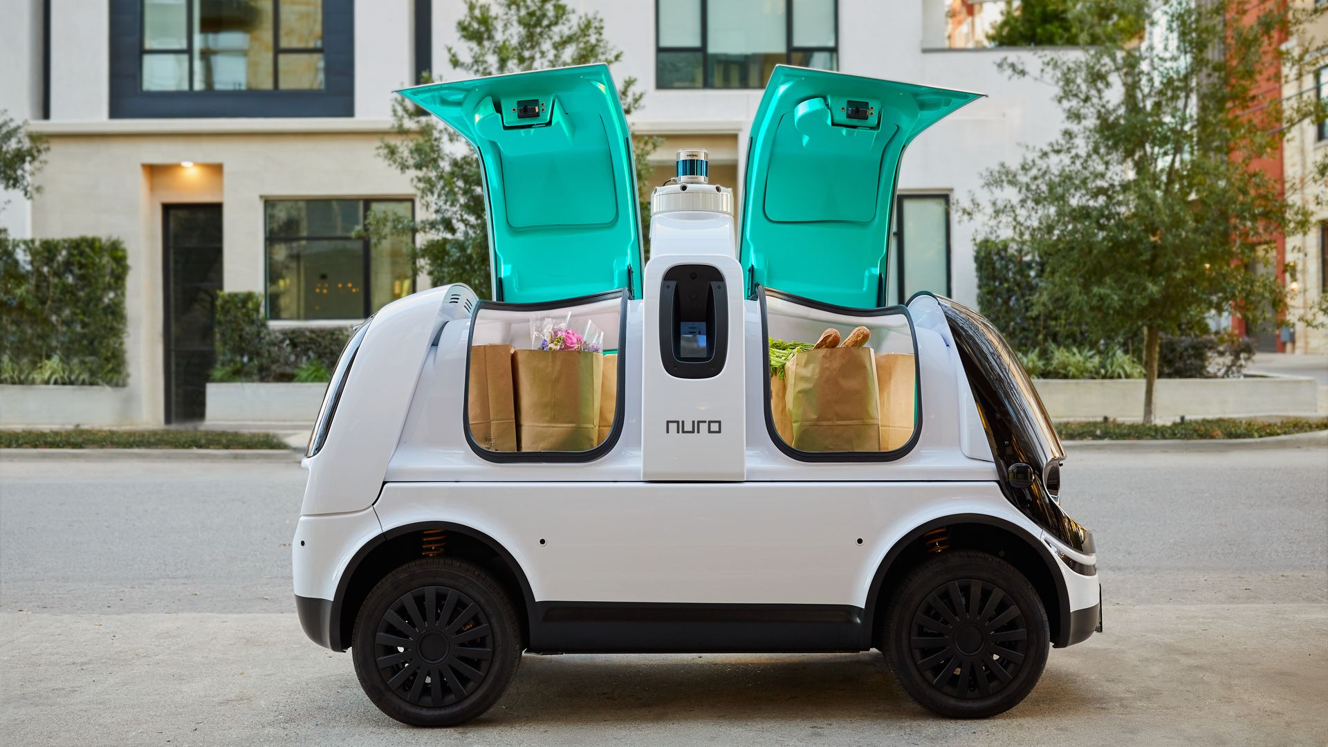 Image of Nuro's delivery vehicle with groceries inside