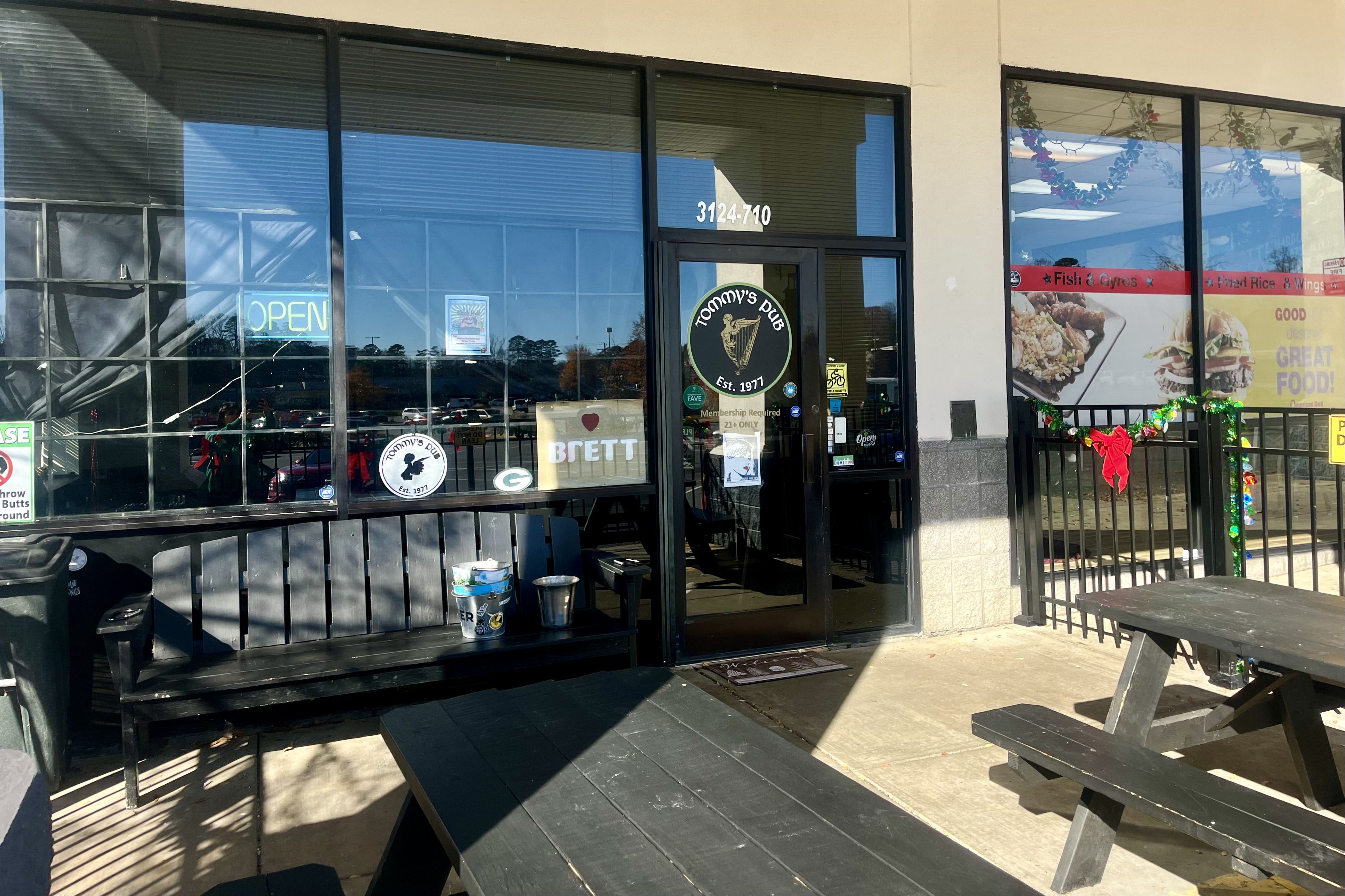 The door of a pub in a strip mall
