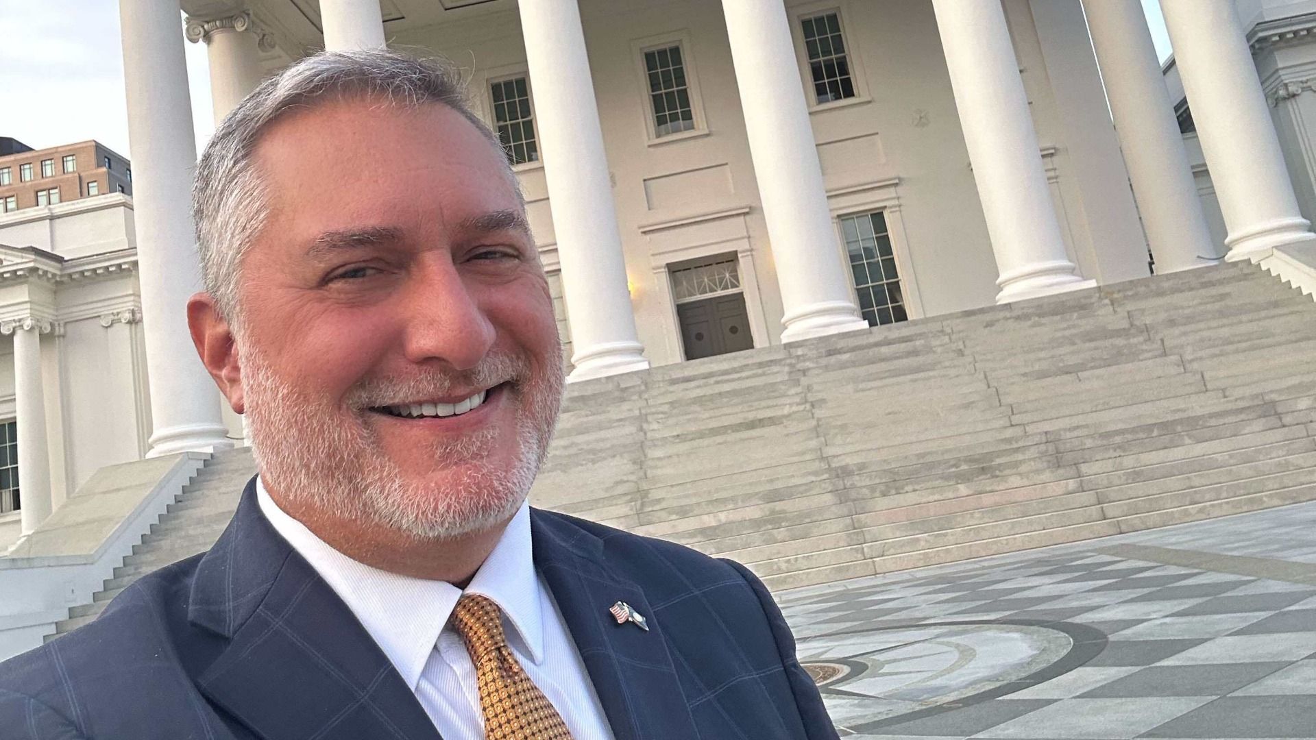 john reid in front of the virginia state capitol