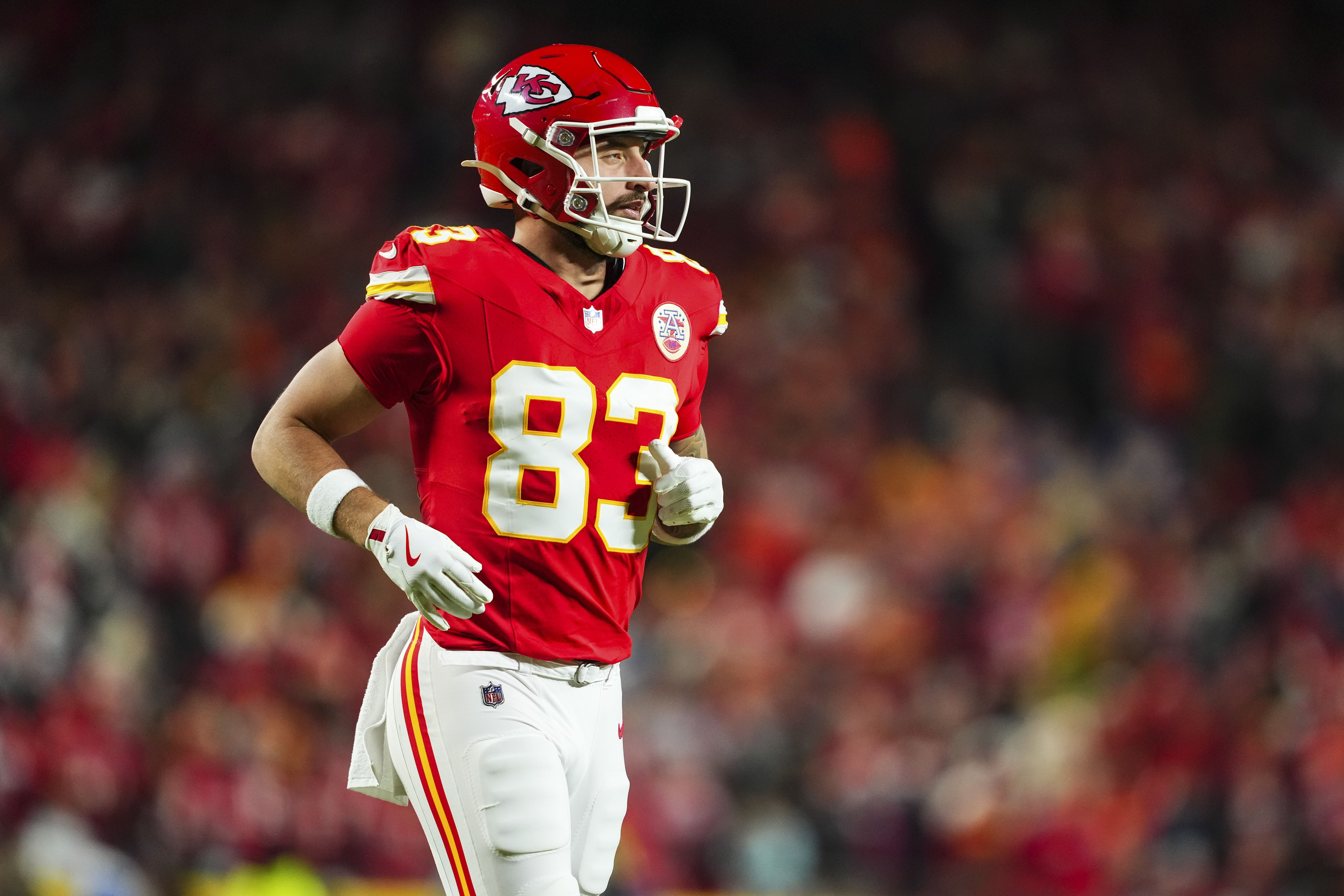 : Noah Gray #83 of the Kansas City Chiefs looks on from the field during an NFL football game against the Los Angeles Chargers at GEHA Field at Arrowhead Stadium on December 8, 2024 in Kansas City, Missouri. (Photo by Cooper Neill/Getty Images)