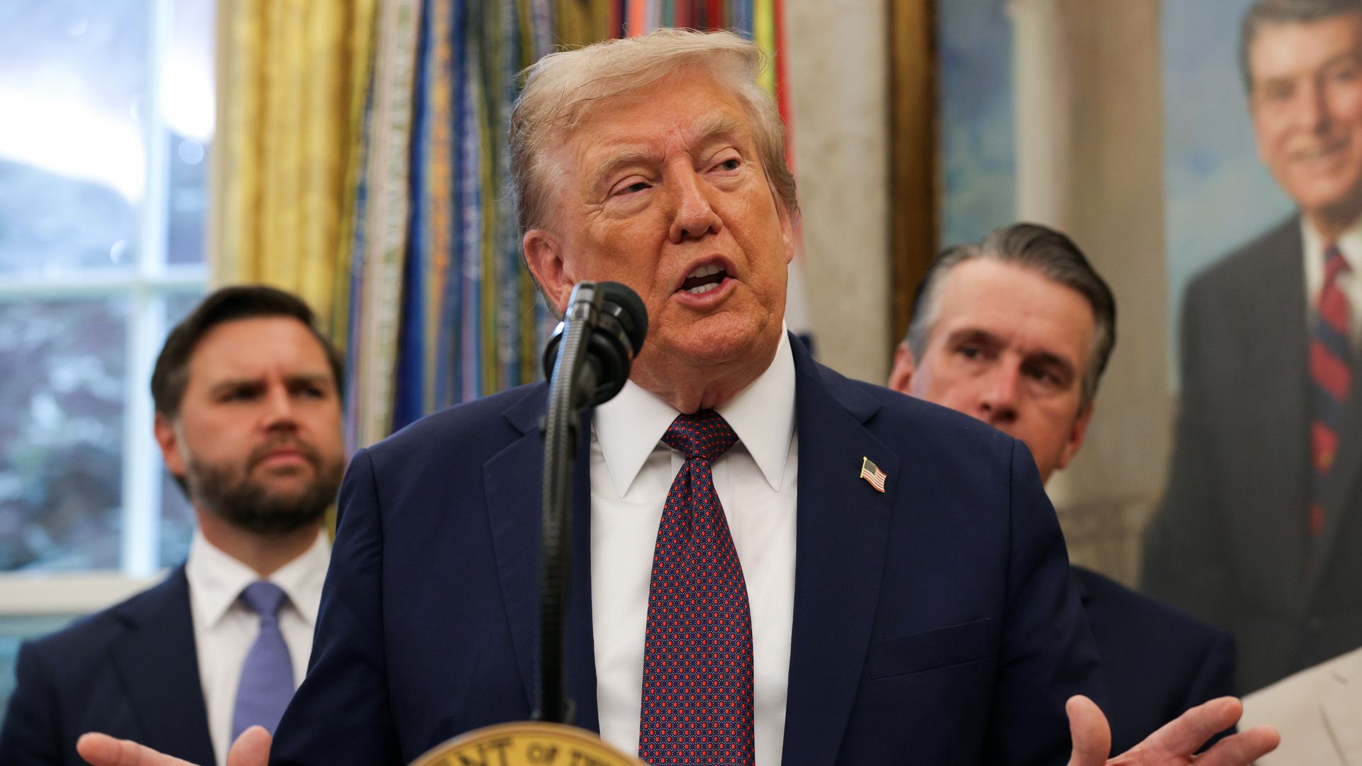 Trump speaking at podium