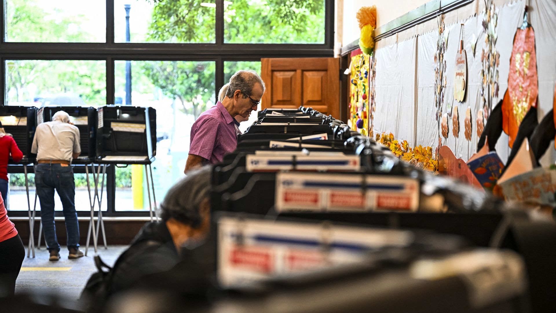 Voters cast their ballots at The Coral Gables Branch Library in Coral Gables, Florida on October 21, 2024. 