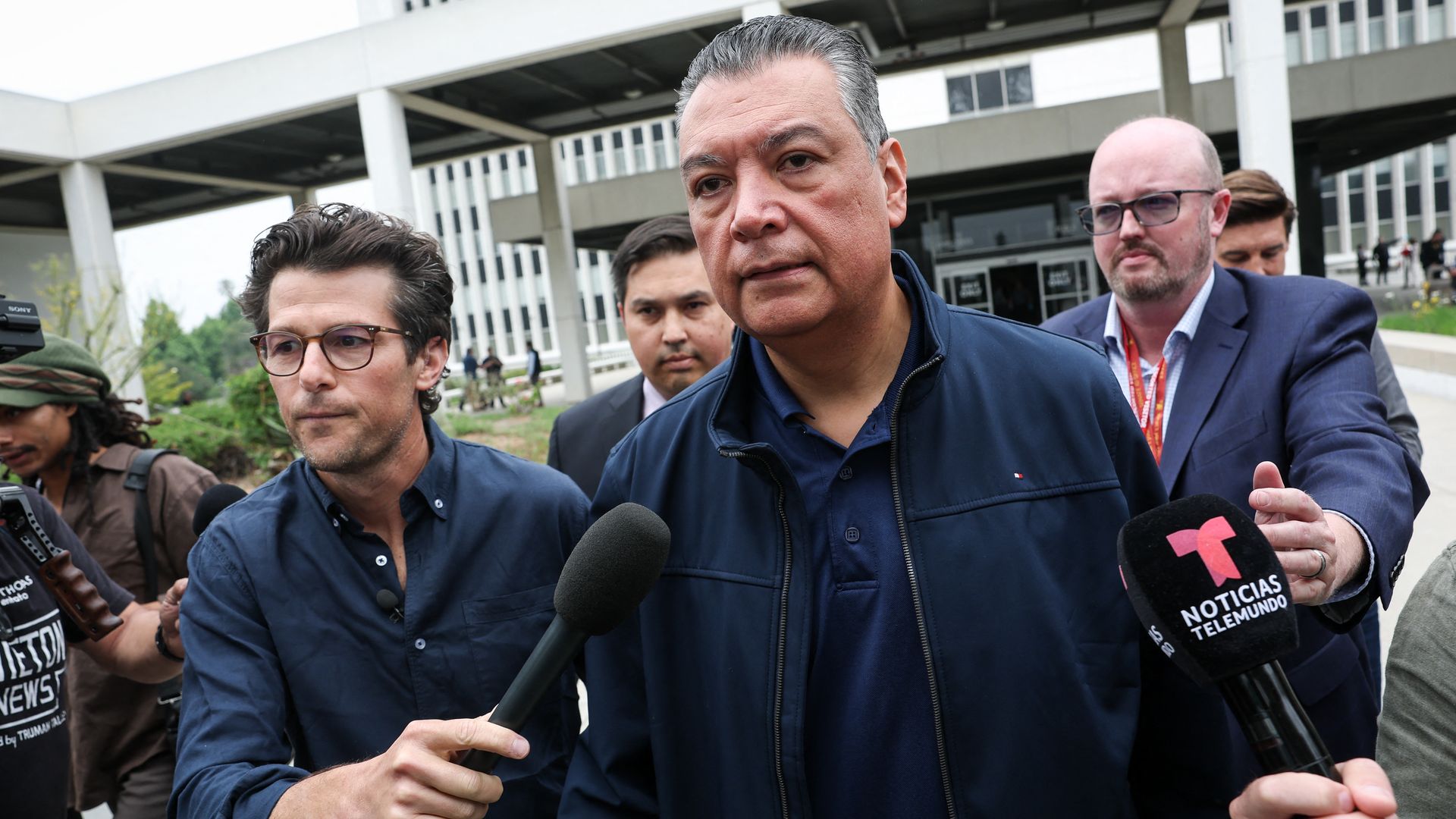 Senator Alex Padilla, Democrat from California, speaks to reporters outside of the Wilshire Federal Building, after he was forcibly removed after interrupting a news conference