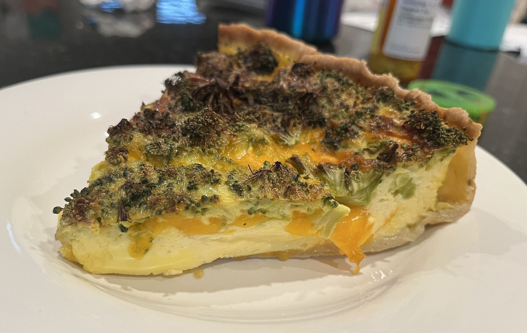 Photo of a slice of quiche on a plate