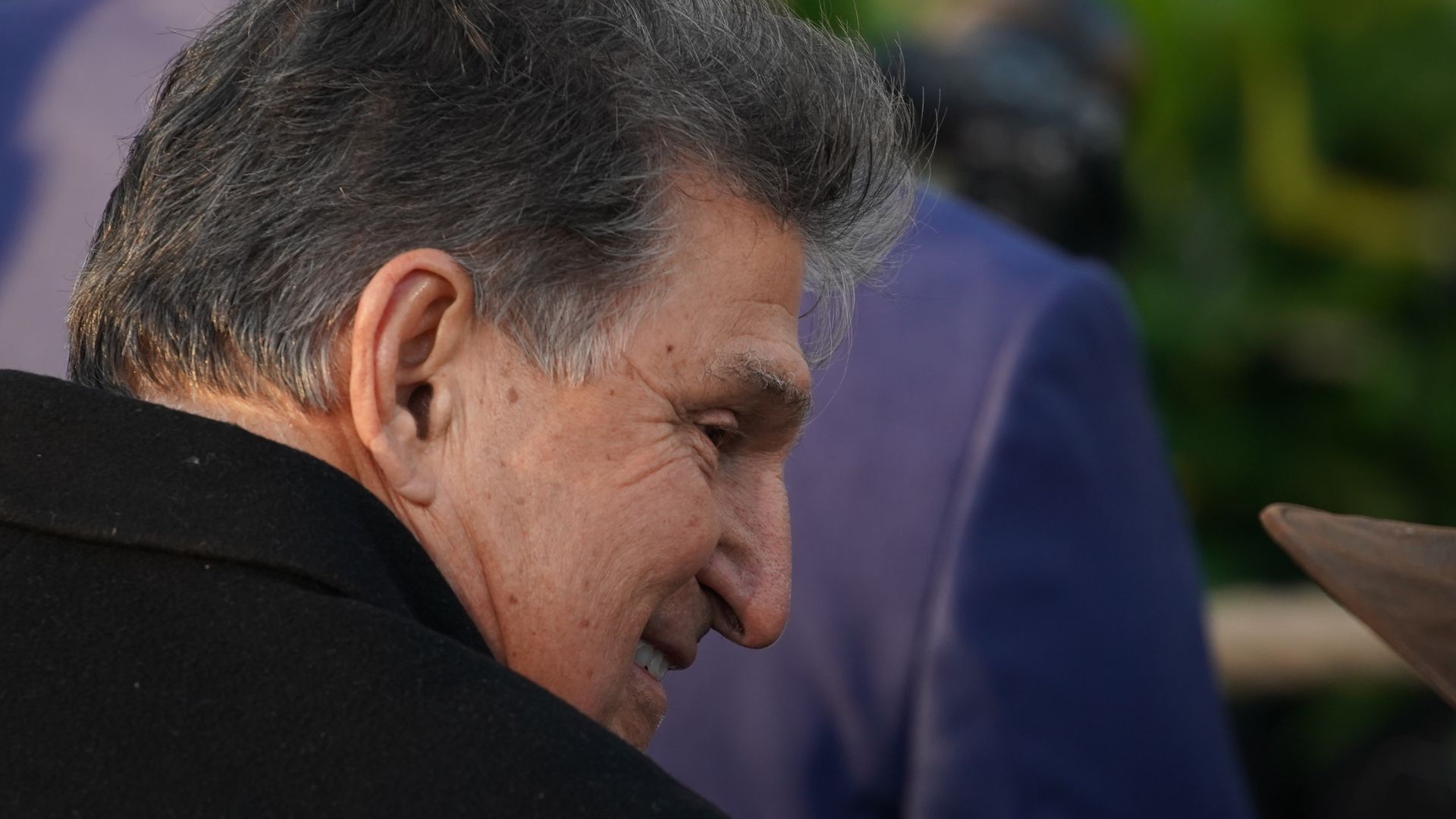 Sen. Joe Manchin is seen in the audience for the signing of the bipartisan infrastructure bill.